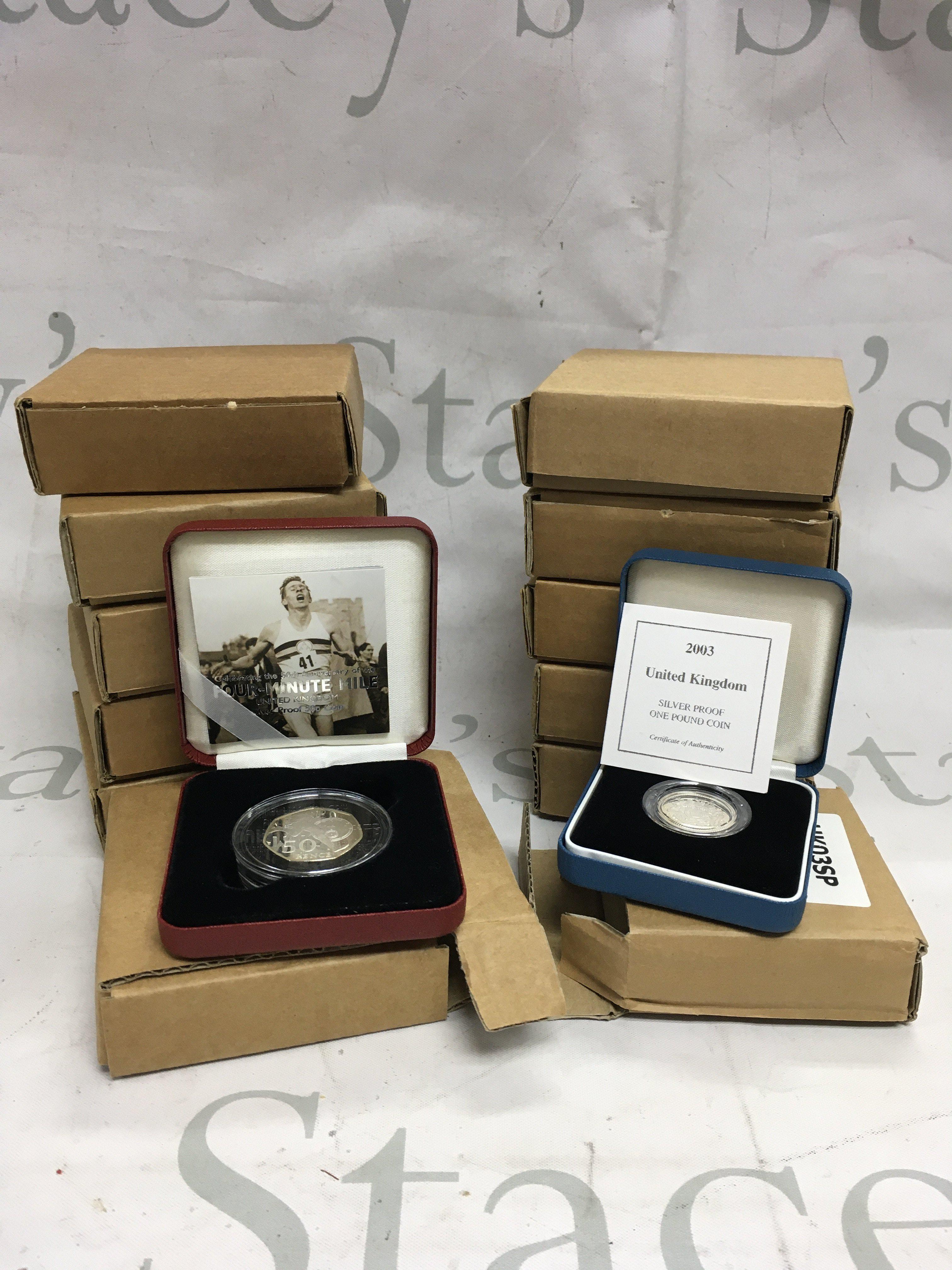 A mixed lot of 12 silver boxed proof coins.