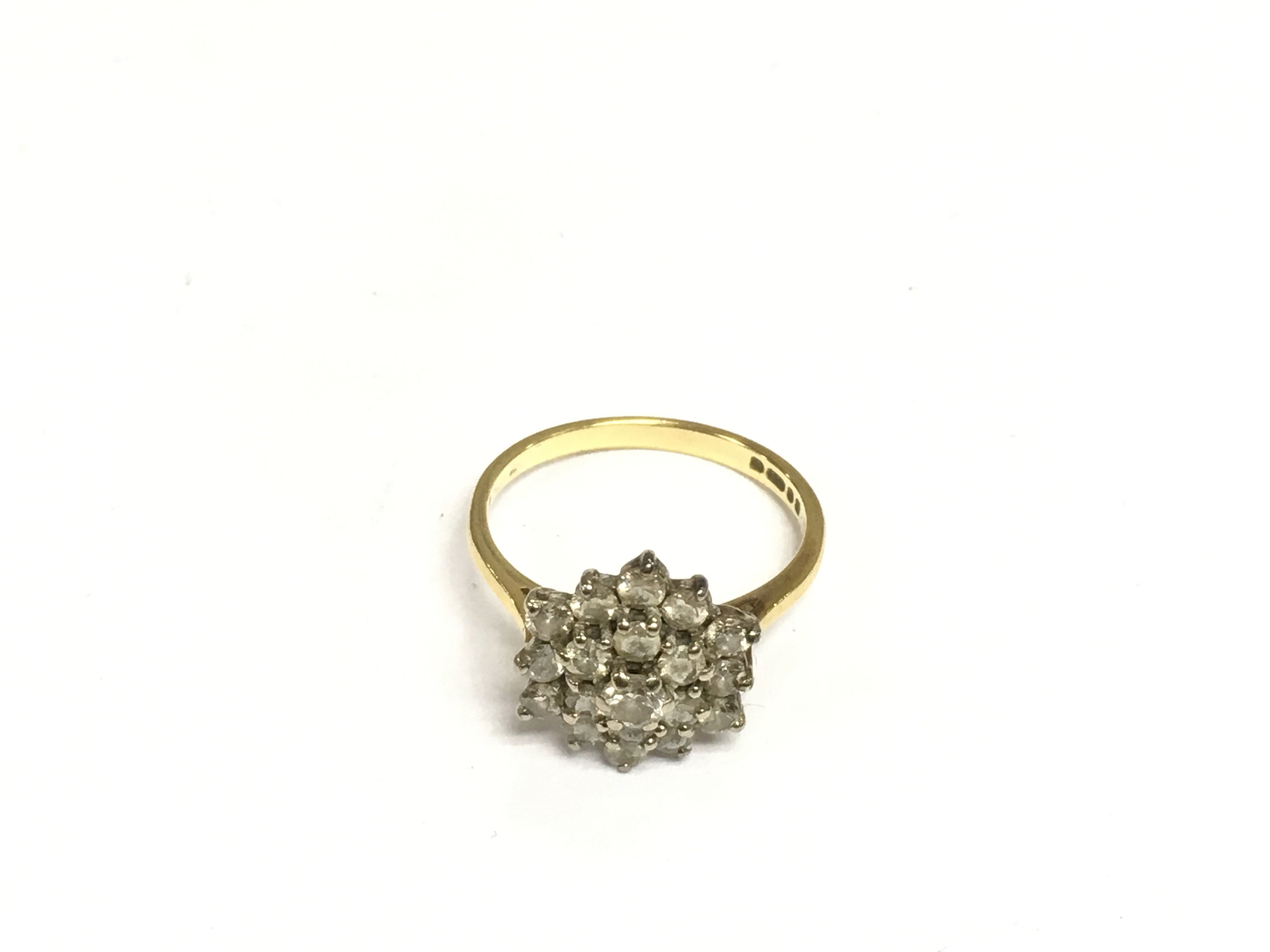 A 9ct gold diamond cluster ring, approx 3.7g and approx size N. Shipping category A.