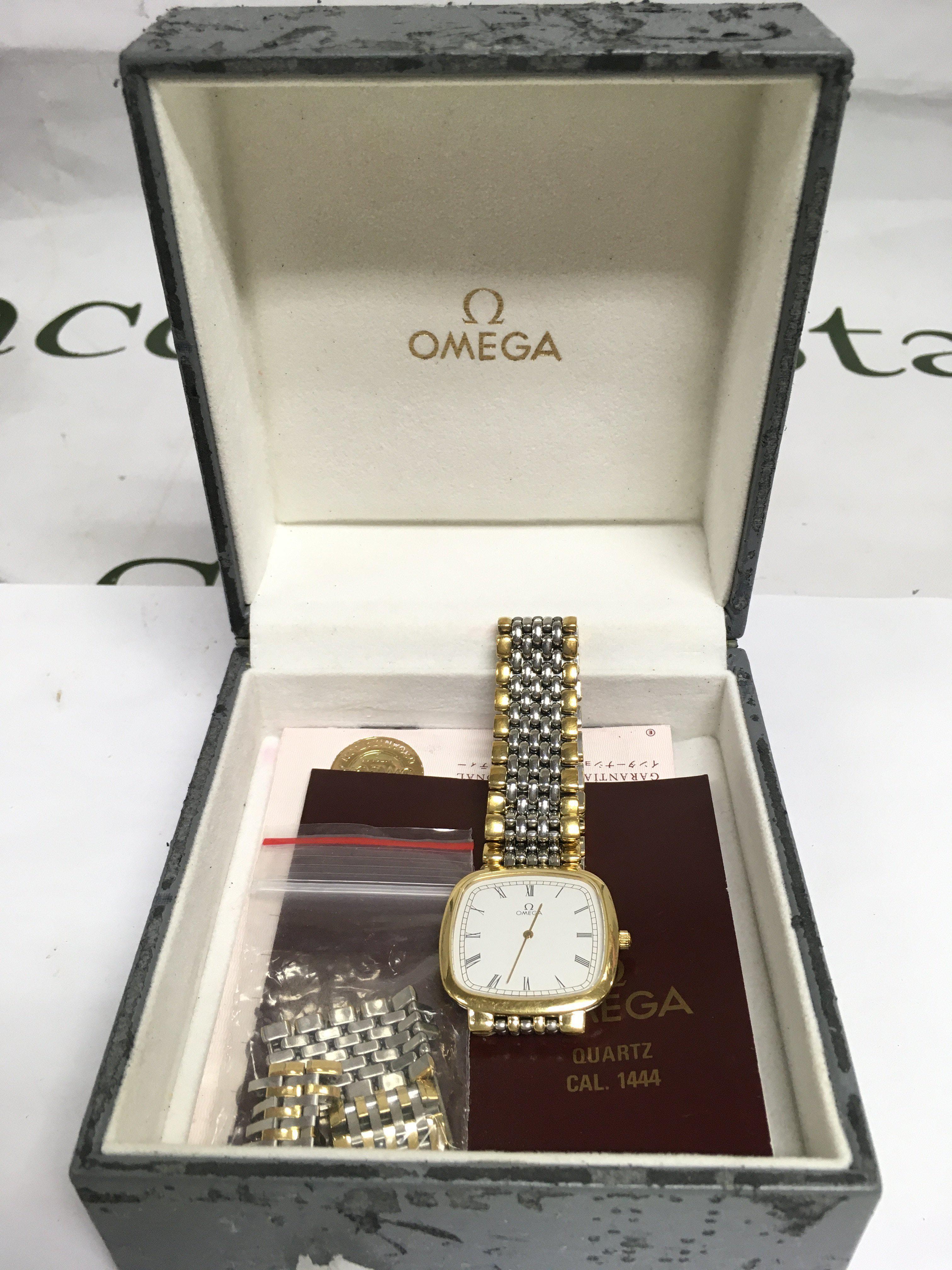 A boxed Omega watch with paperwork. Shipping category B.