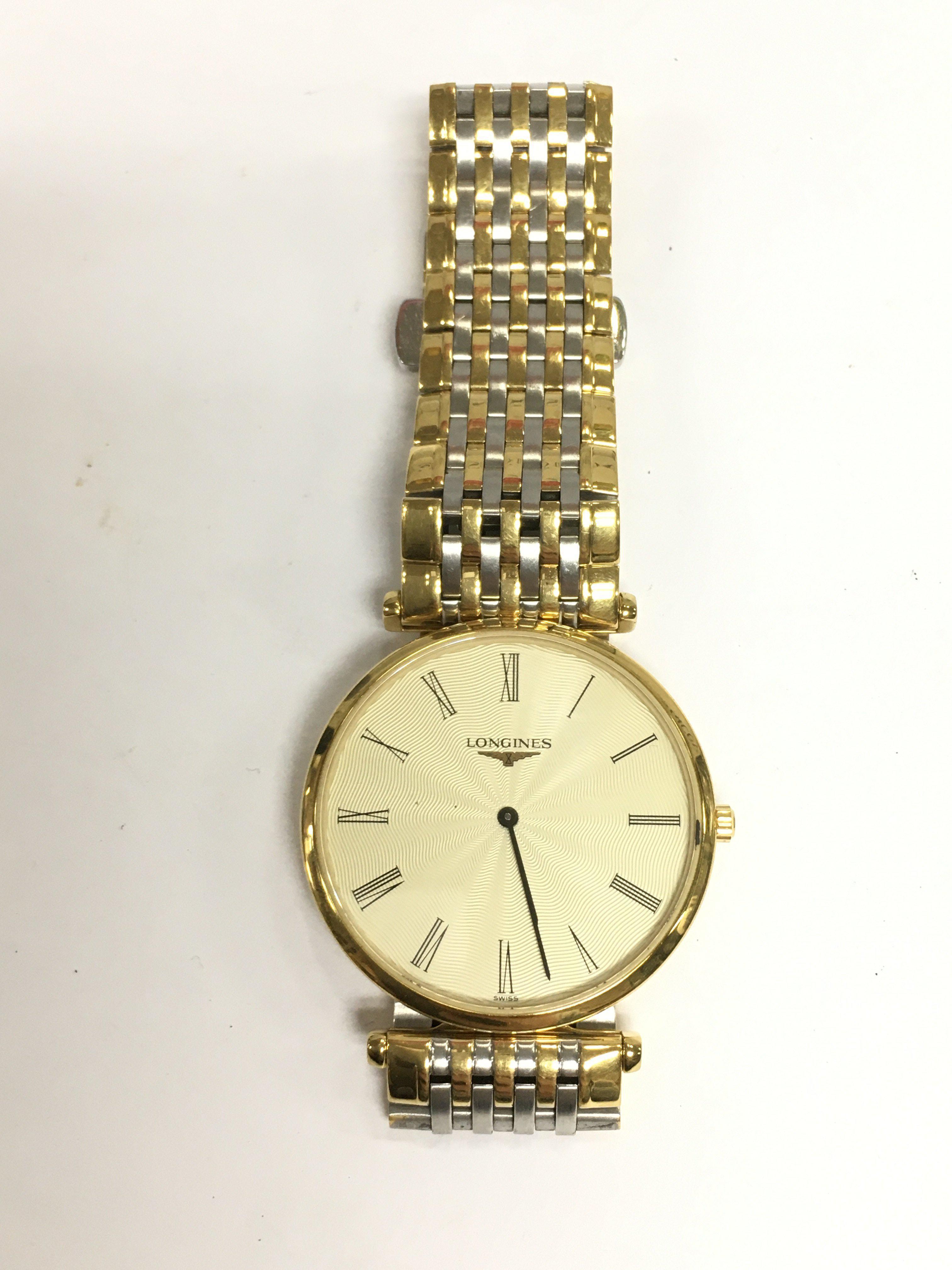 A Longines watch with bi metal strap. Shipping category A.