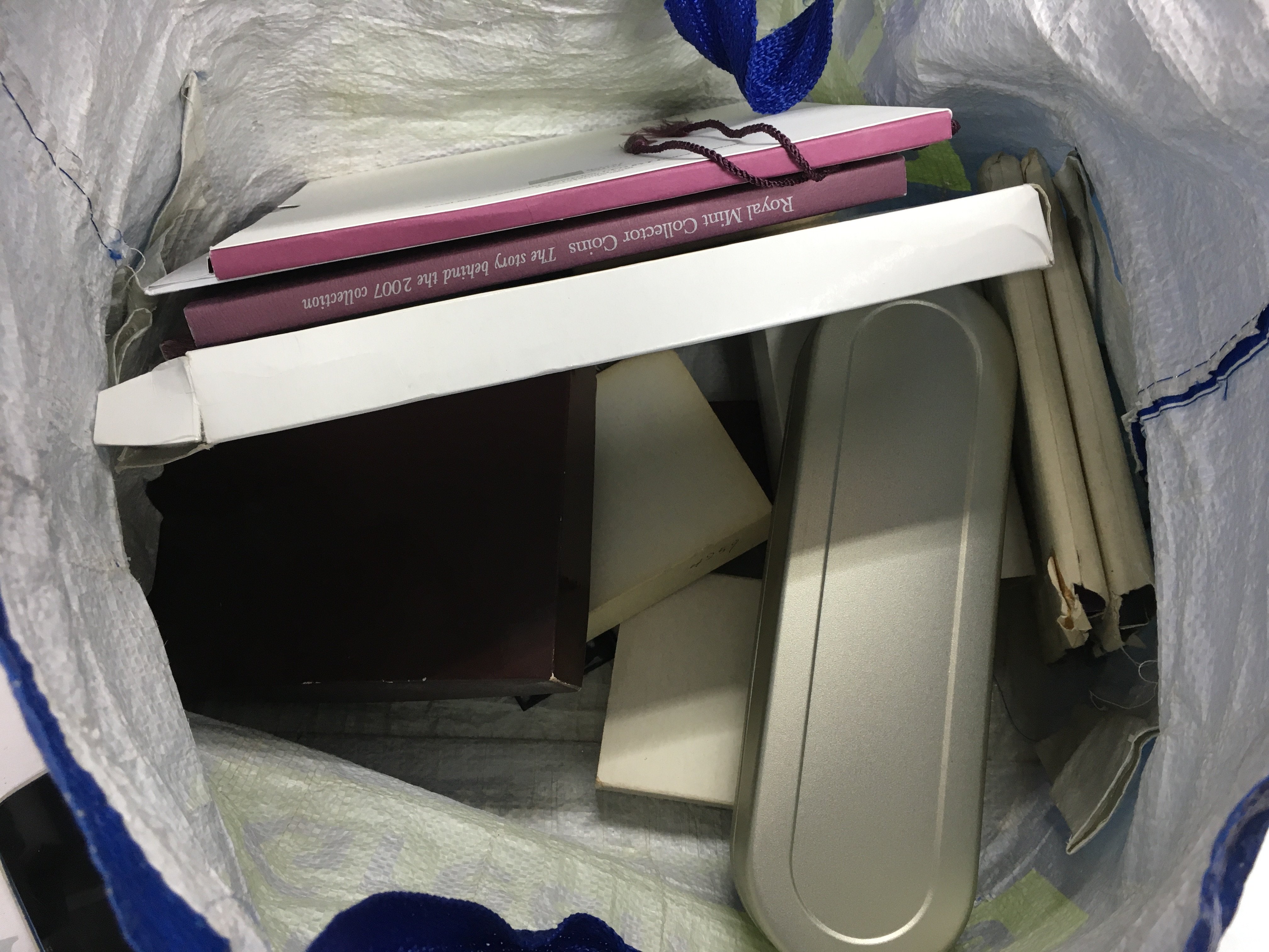 A bag of mixed coinages including loose coins and coin sets.