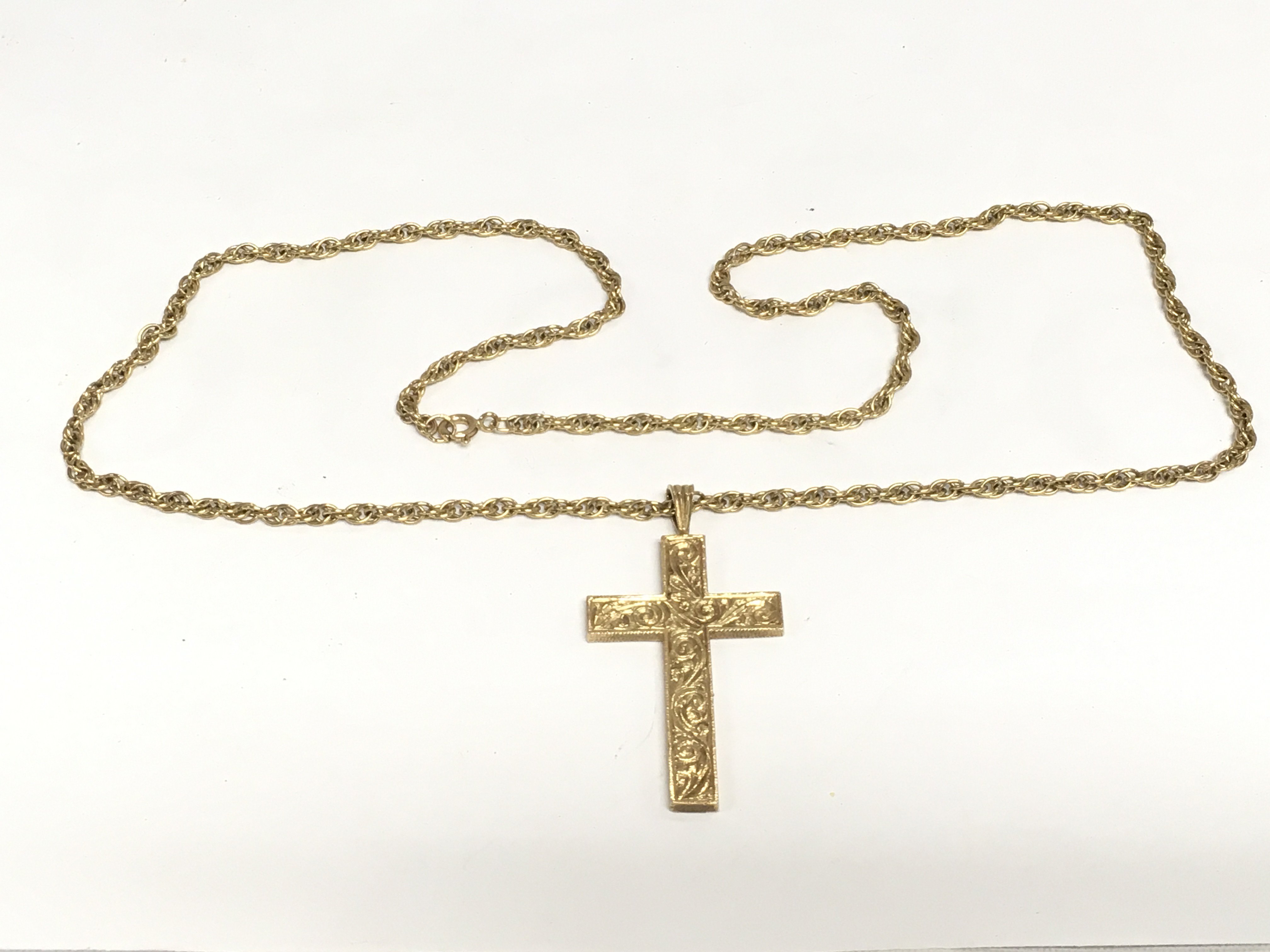 A 9ct gold cross on a 9ct gold chain, total approx 22.5g, cross 4cm in height. Shipping category A.