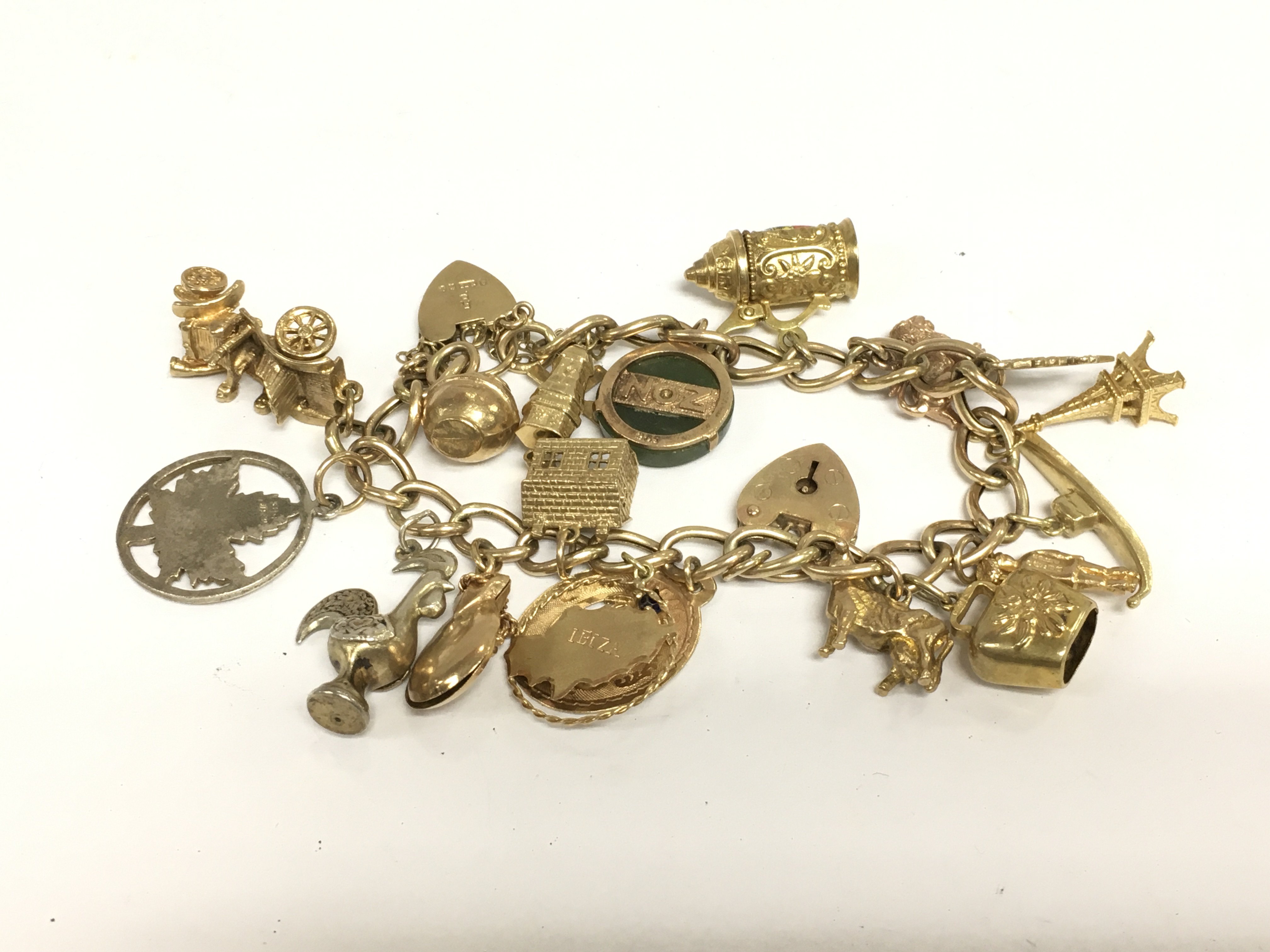 A 9ct gold charm bracelet, approx 40g. Shipping category A.