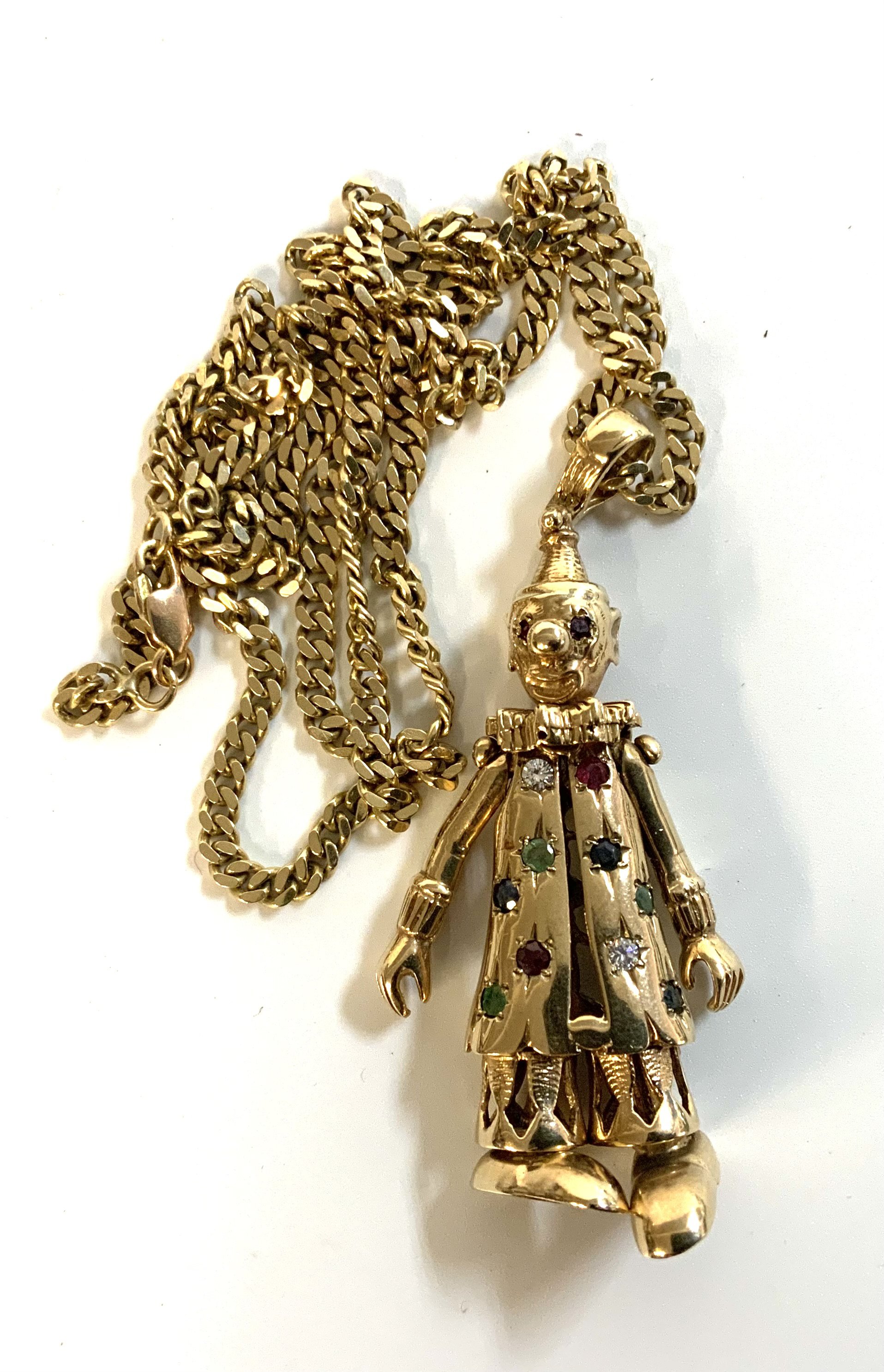 A vintage heavy 9ct gold clown pendant inset with precious stones. 42.2g