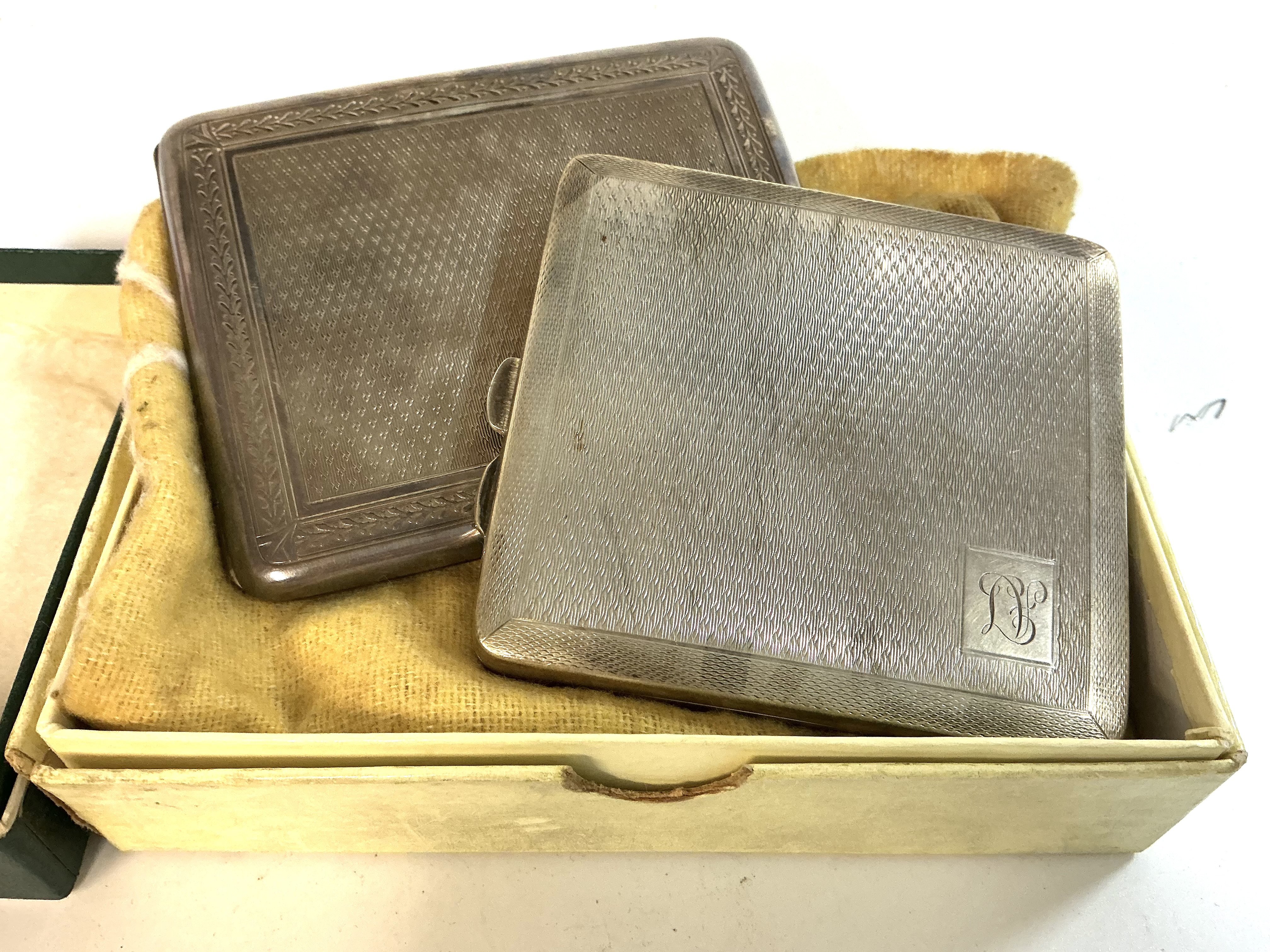 2 heavy hallmarked silver cigarette cases.