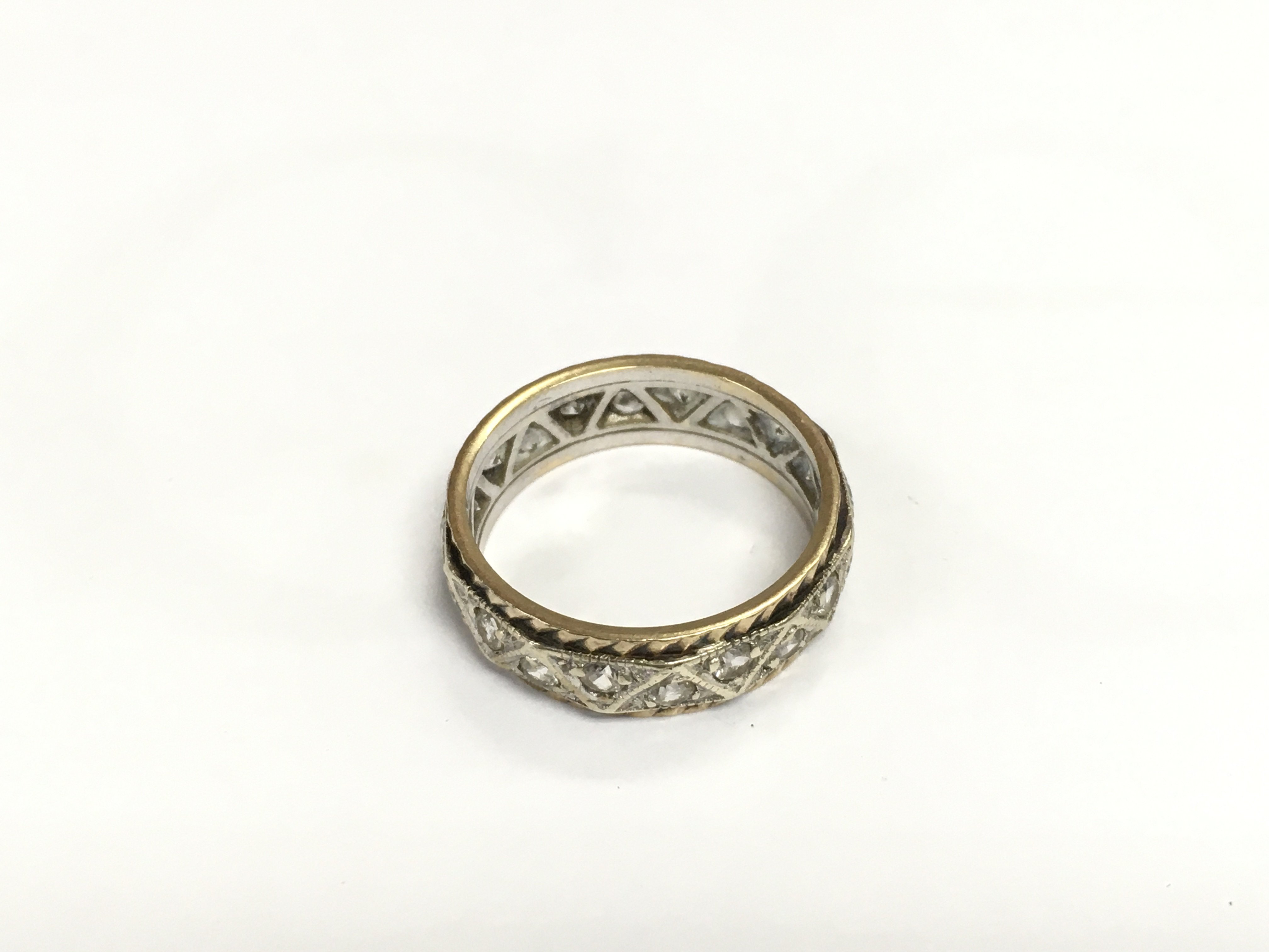 A gold eternity ring, approx 3.8g and approx size L-M. Shipping category A.