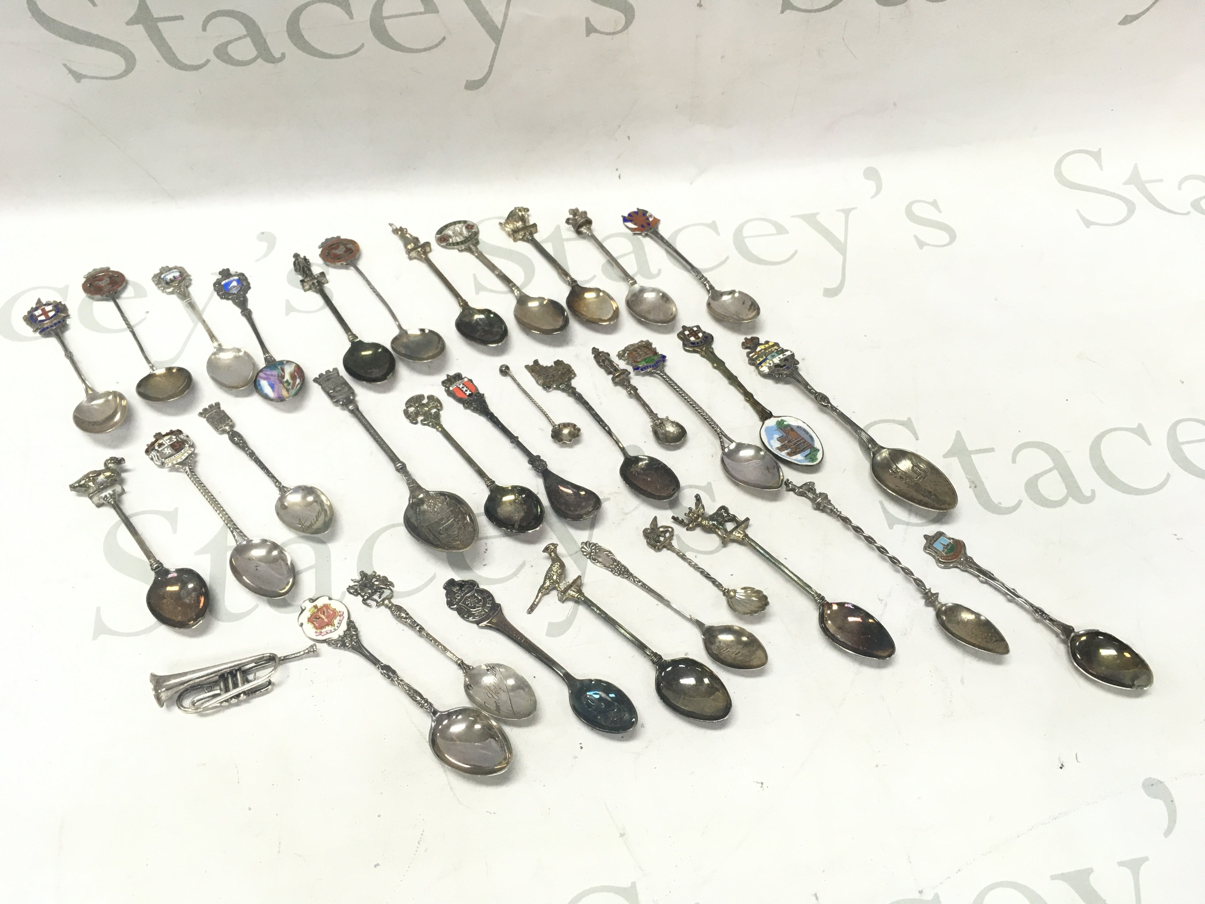 A collection of souvenir spoons including some silver hallmarked examples . Postage category B