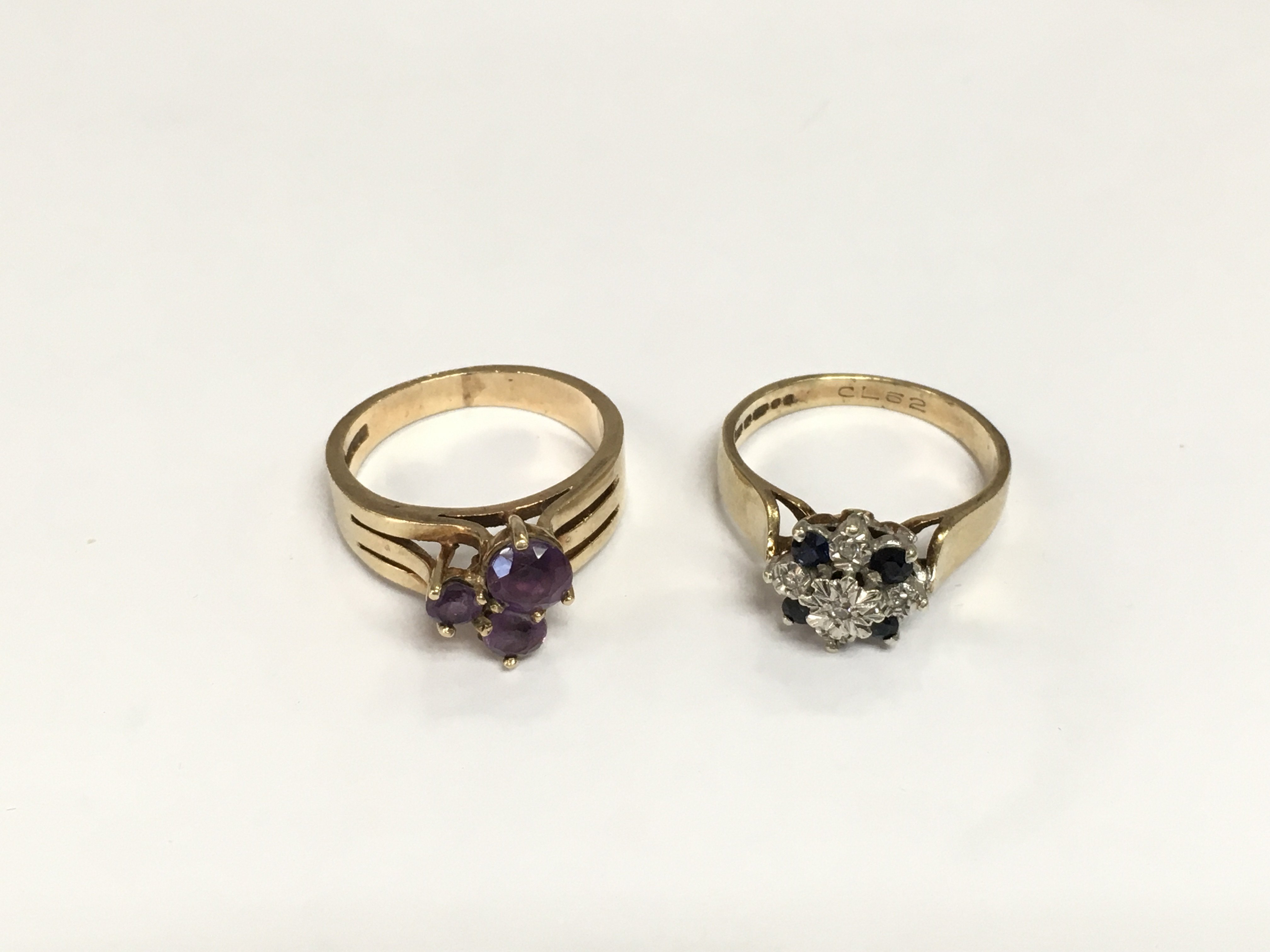 Two 9ct gold rings one set with amethyst and another set with diamonds and sapphires, total approx weight 7g and both approx size L. Shipping category A.