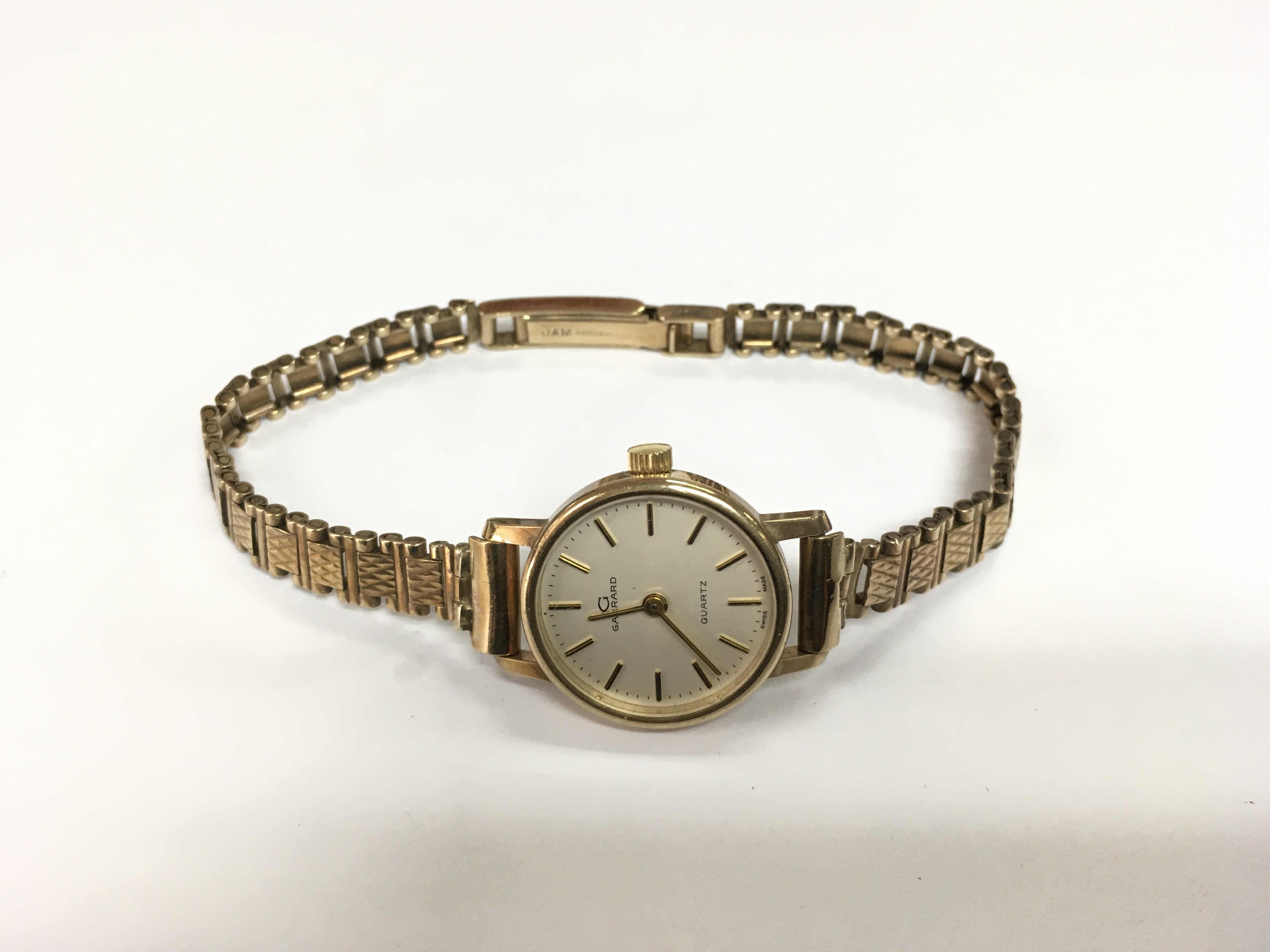 A 9ct gold ladies Garrard watch with personal inscriptions. Shipping category A.