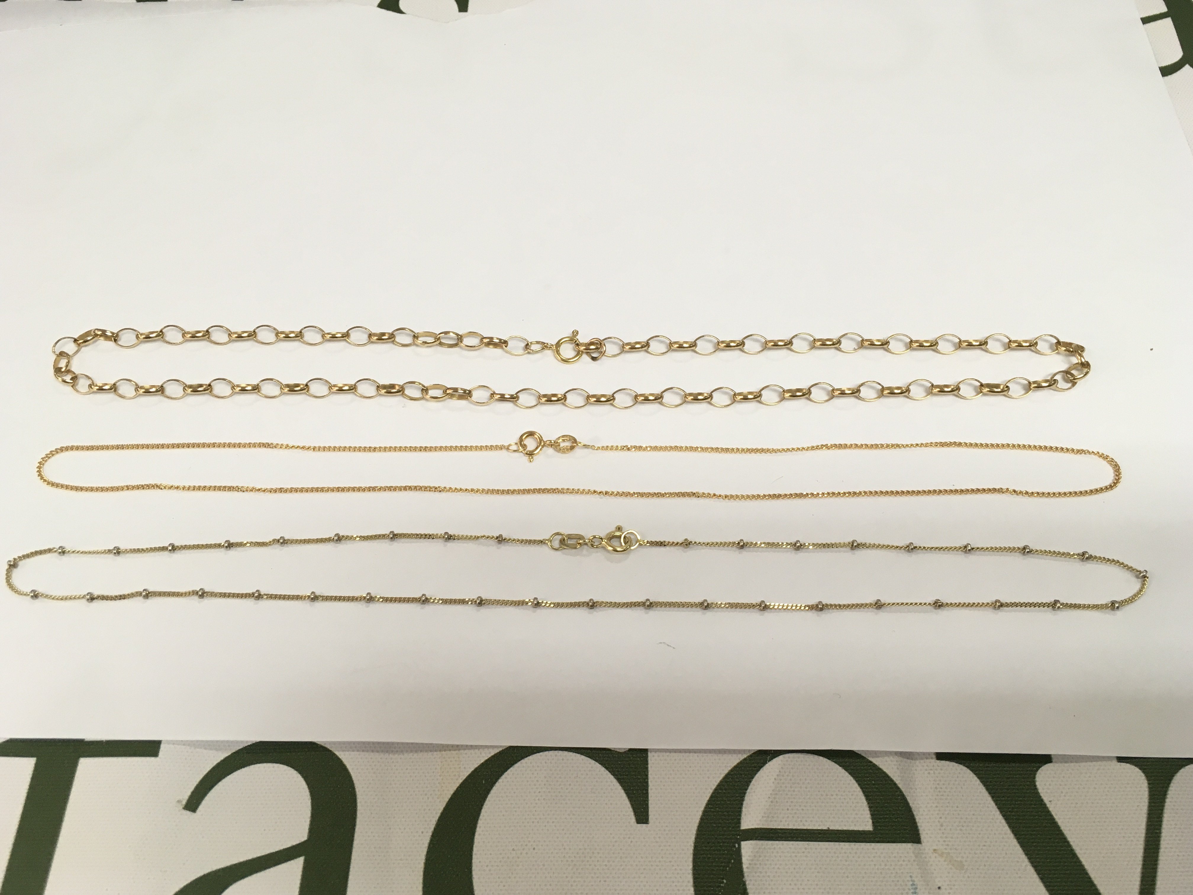 Three 9ct gold necklaces, approx total weight 9g. Shipping category A.