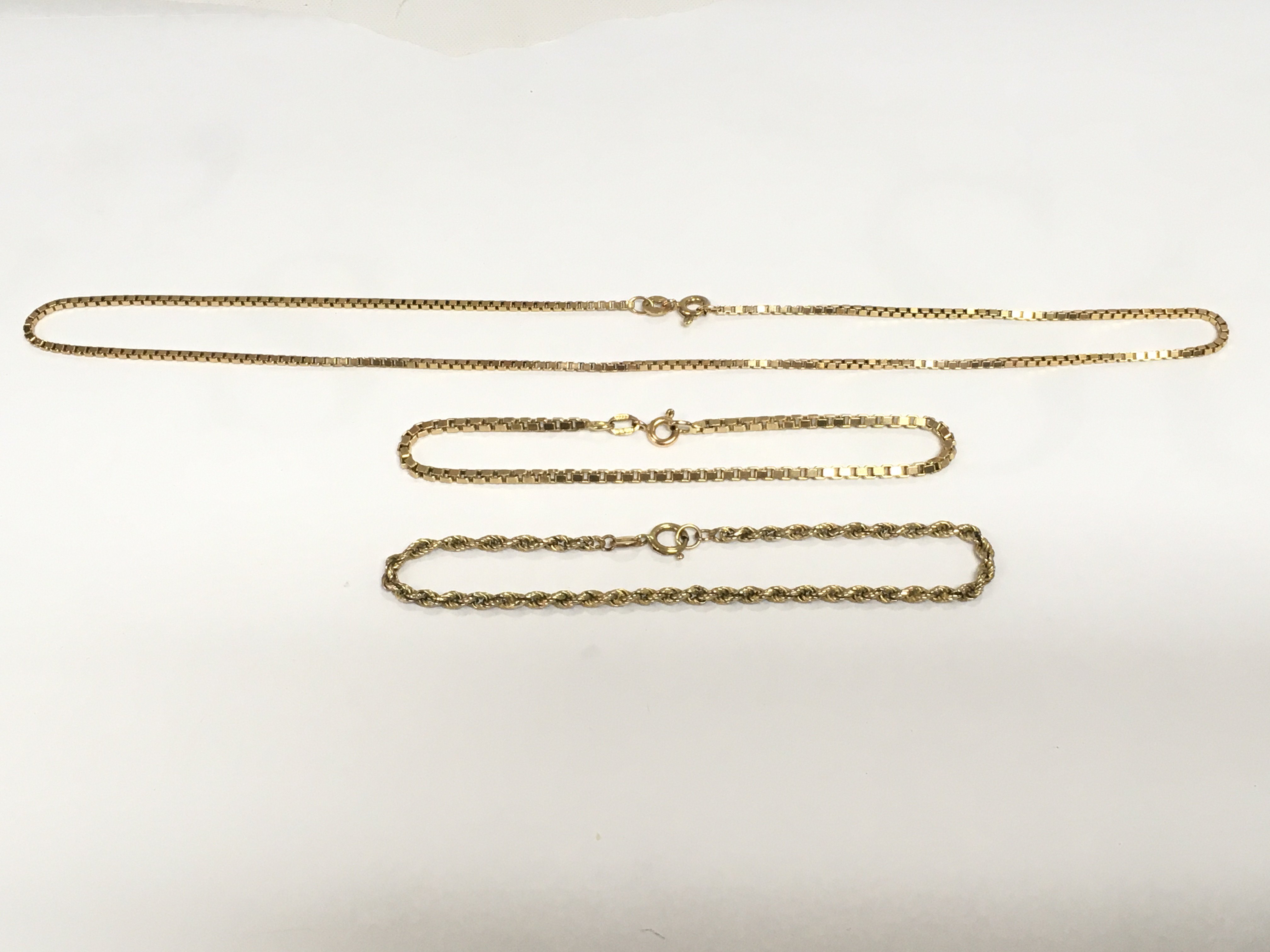 A 9ct gold box link necklace and matching bracelet plus one other 9ct gold bracelet, approx total weight 10g. Shipping category A.