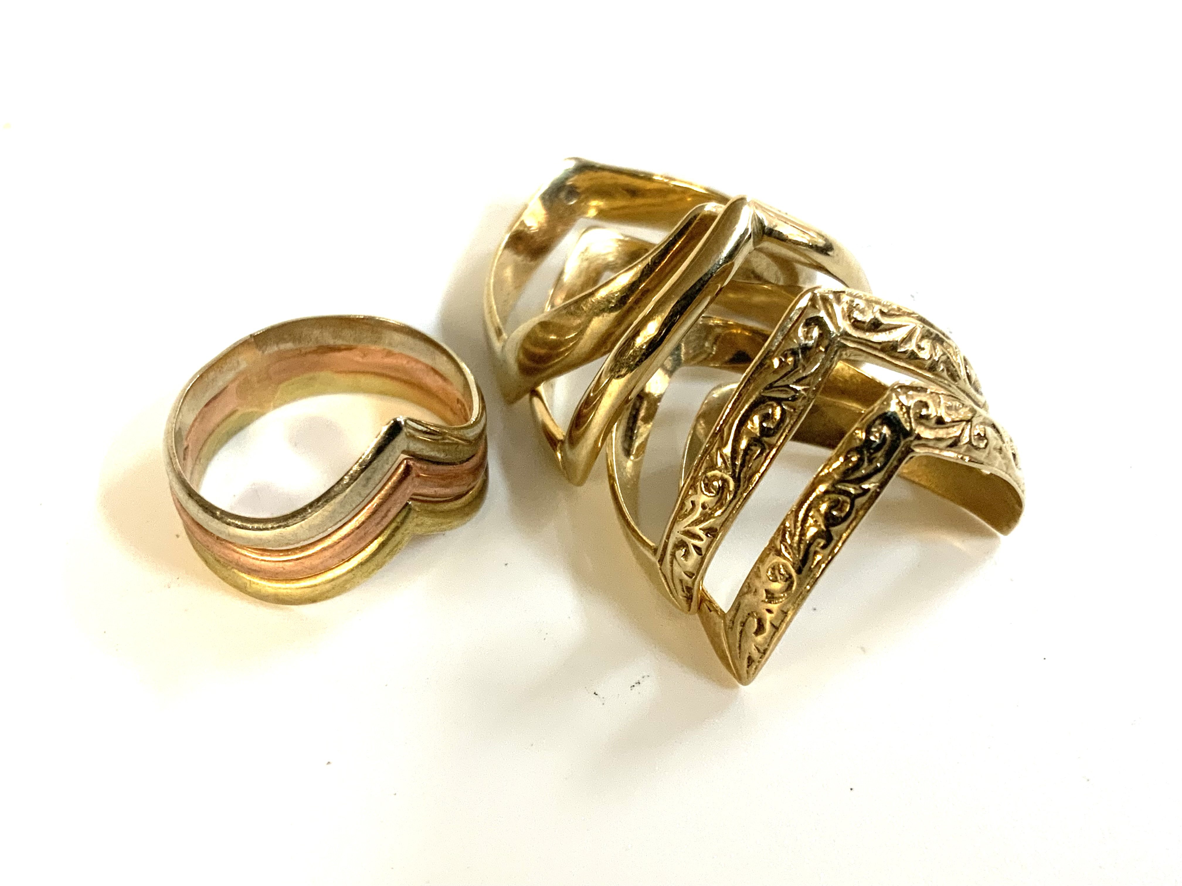 a small collection of 9ct gold wishbone rings.