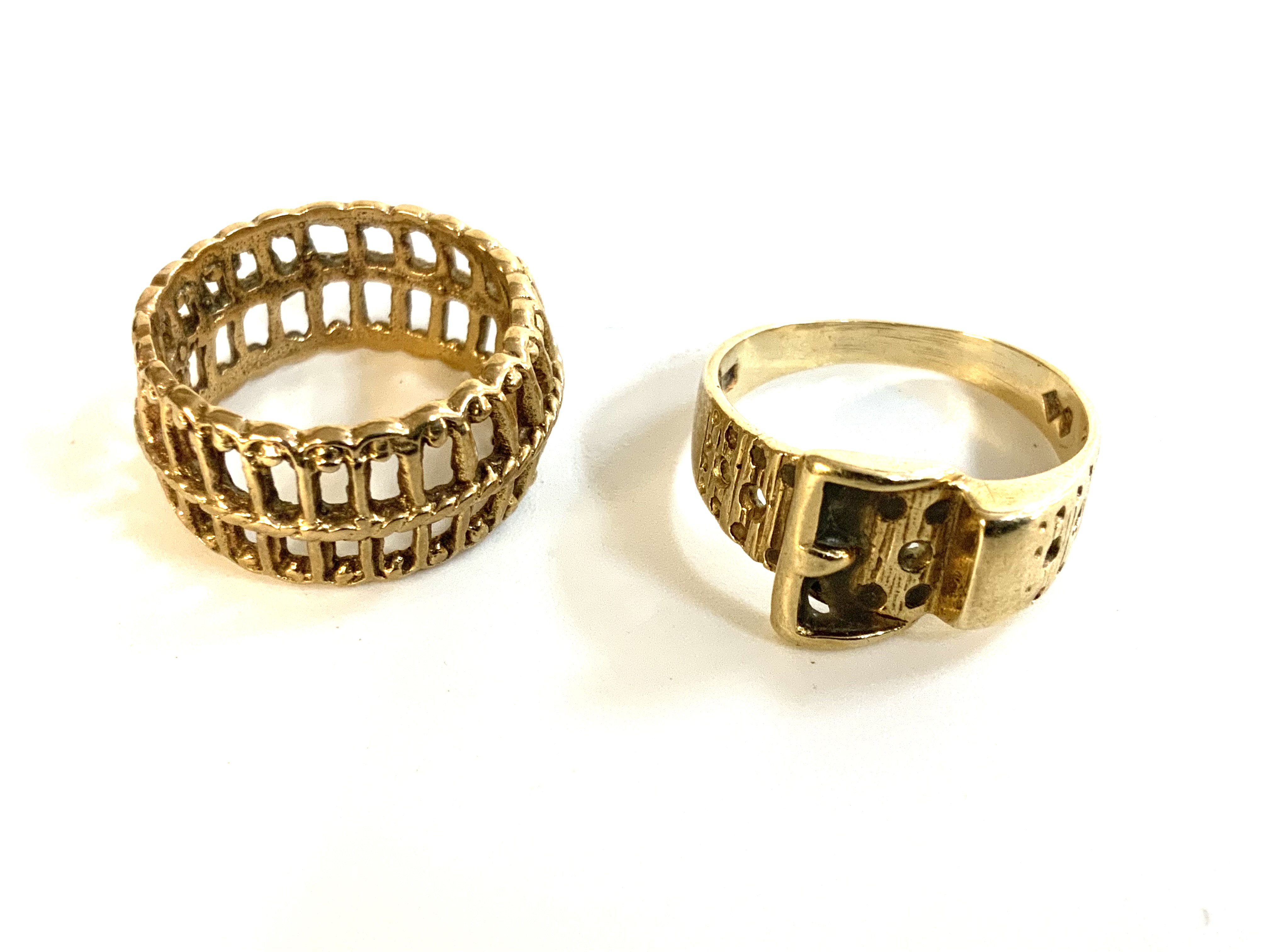 a 9ct gold (unmarked) basket weave design ring (F), 9ct gold buckle design ring (I.5)