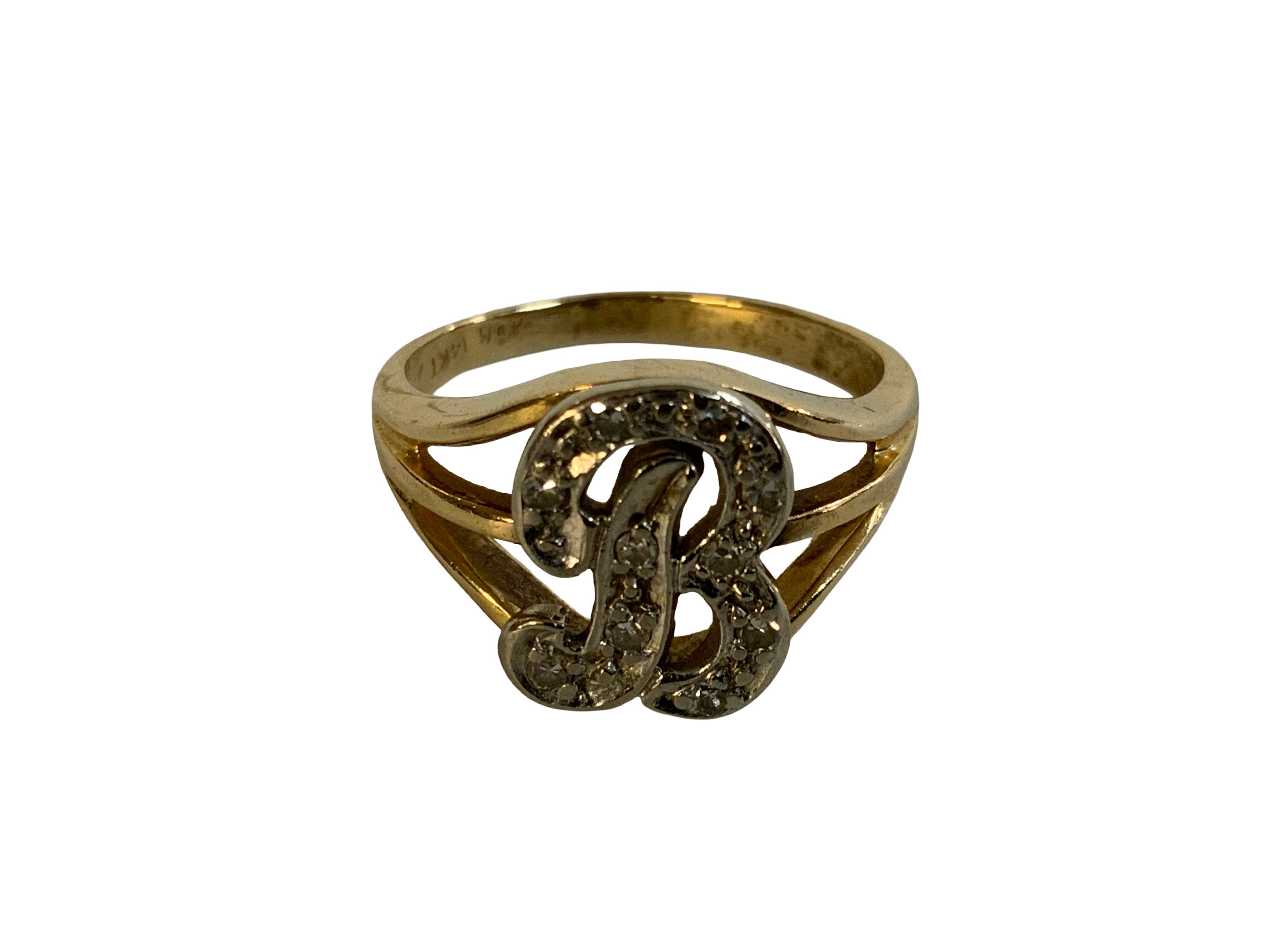 A 14ct yellow gold ring set with diamonds inset into a B initial. (A)