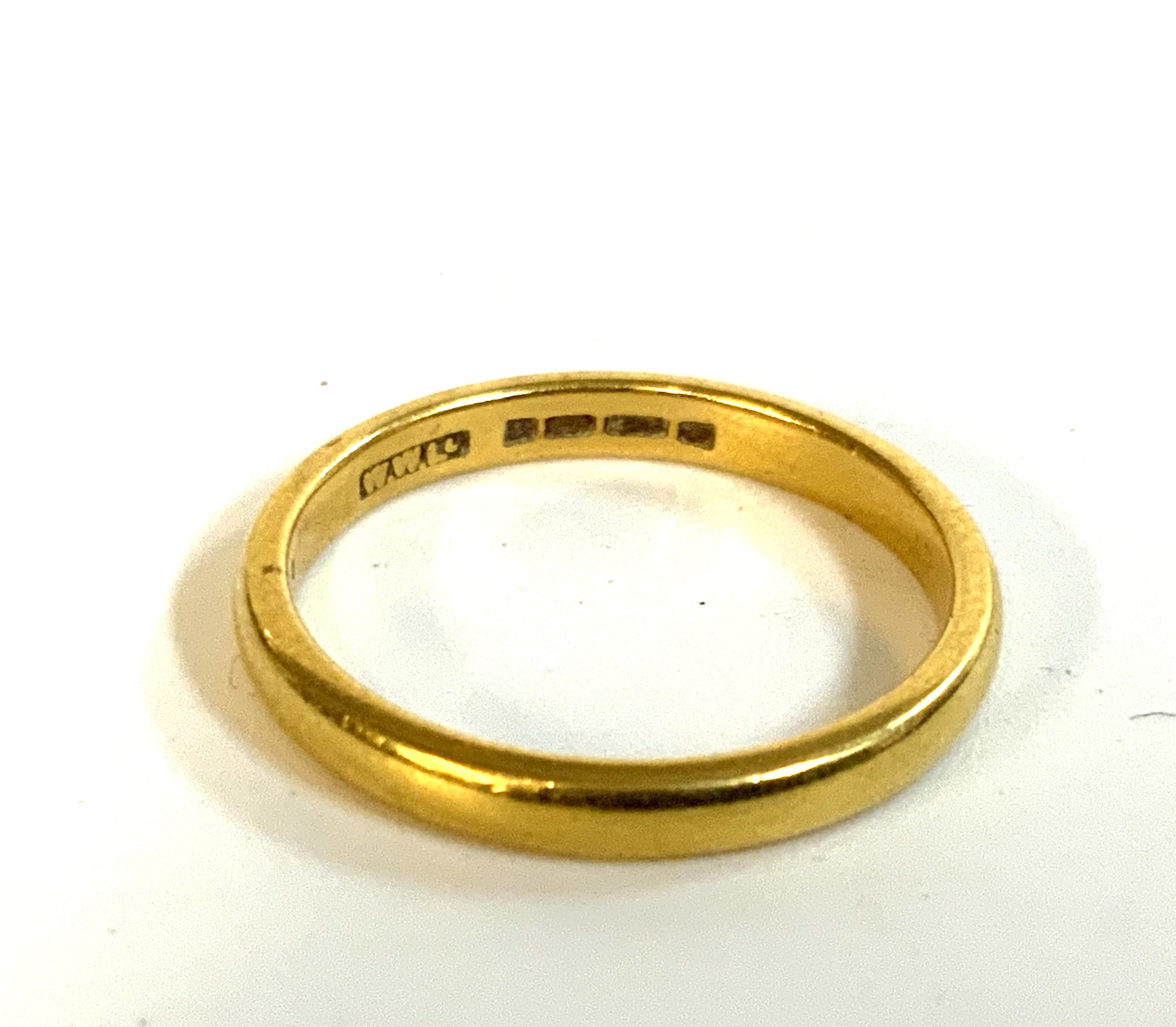A 22ct gold wedding band.