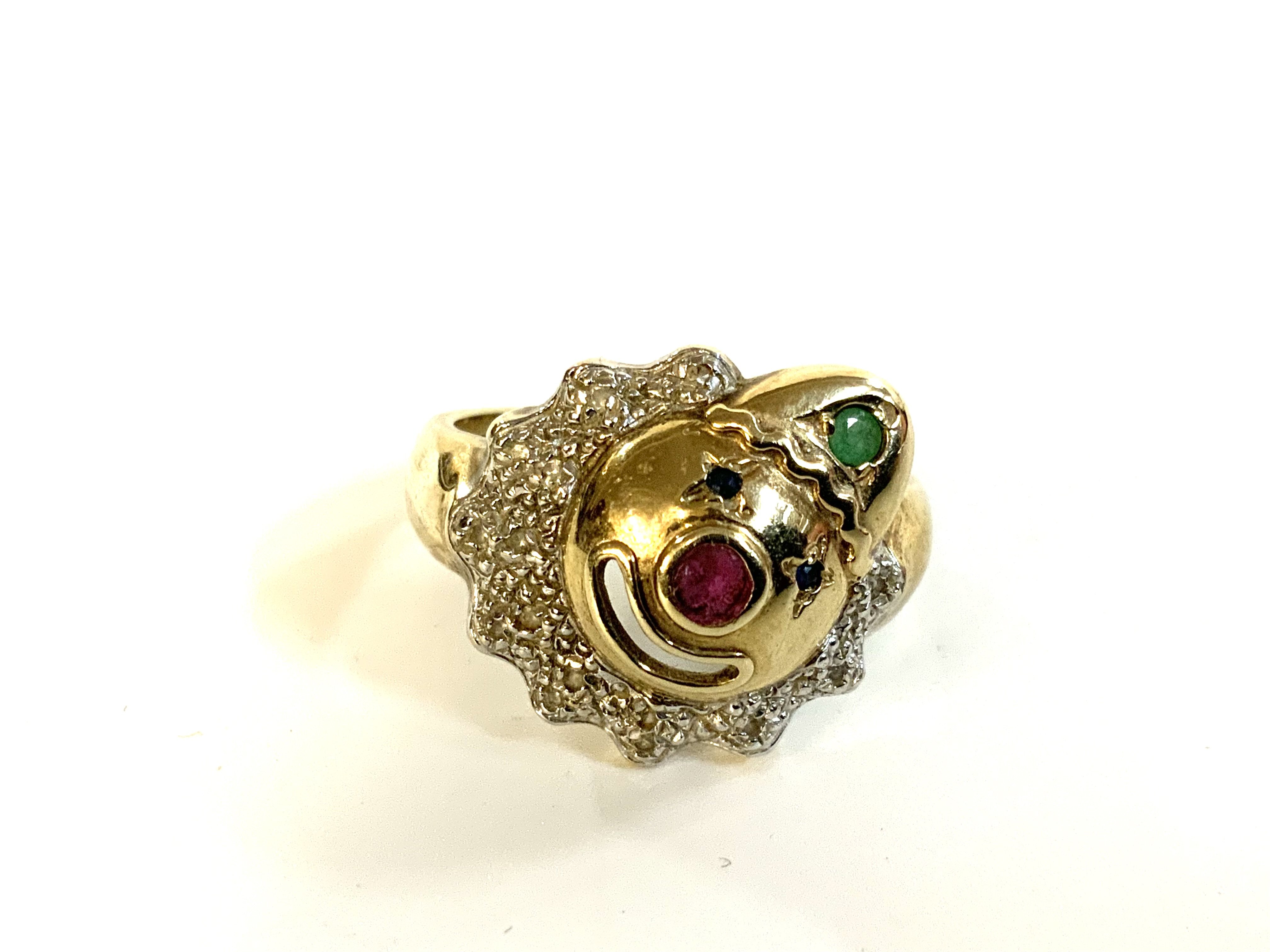 A 9ct gold clown face ring inset with precious stones. R.5 (A)