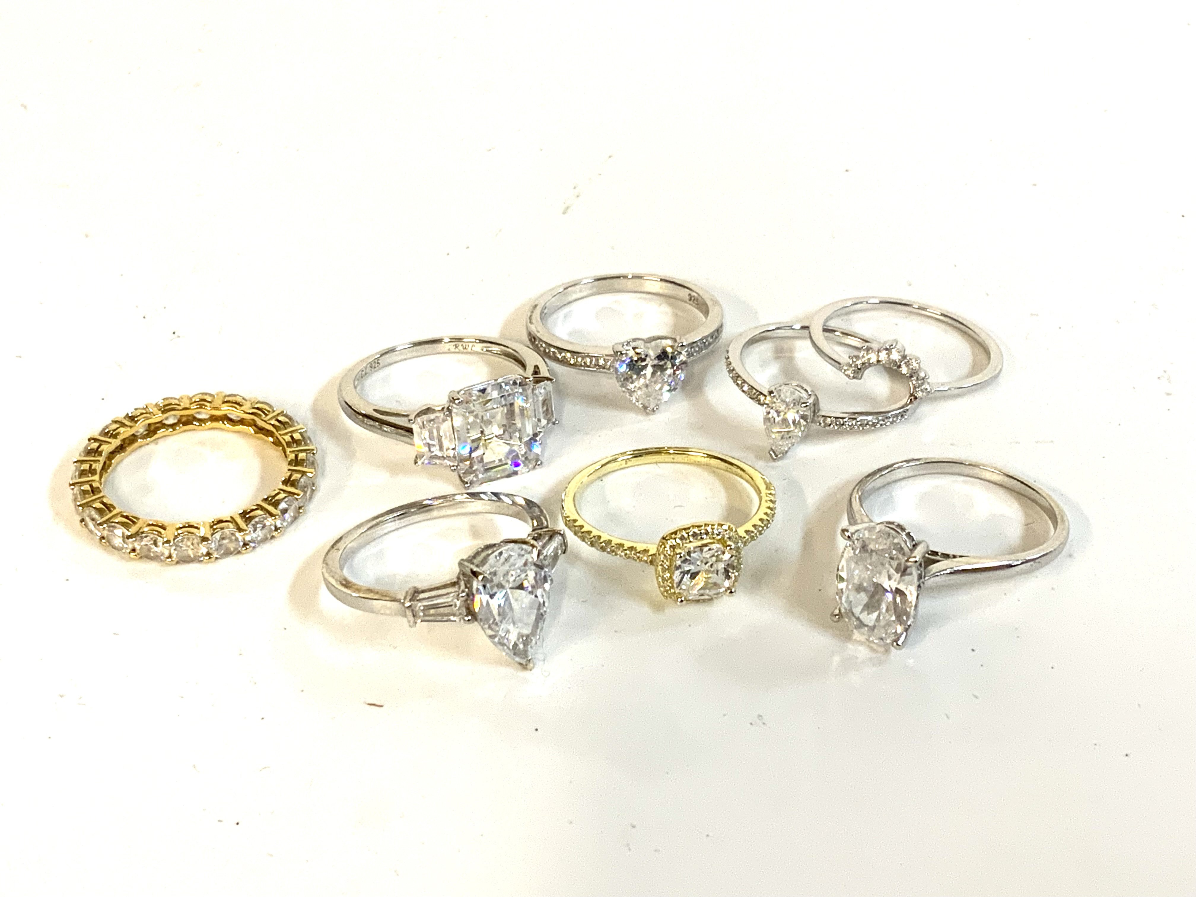 a collection of sterling silver stone set fashion rings. (A)