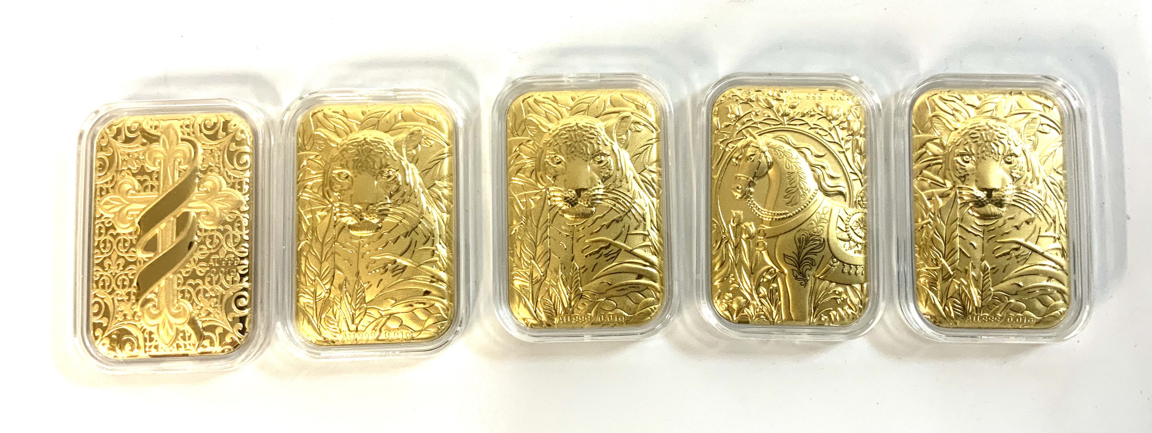 5 0.01g fine gold capsulated pressed panels.