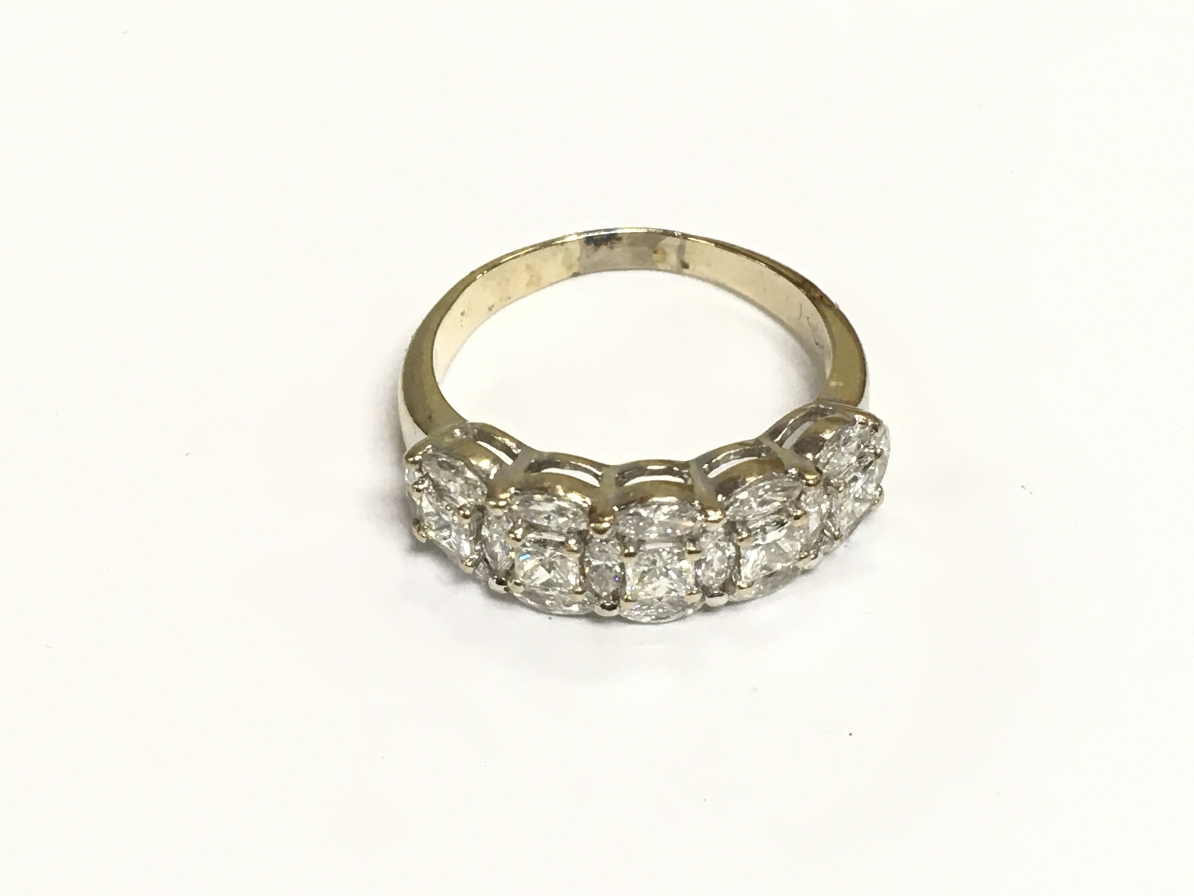 An 18ct gold five stone diamond ring, approx 1.5ct plus, approx 4.9g and approx size P. Shipping category A.