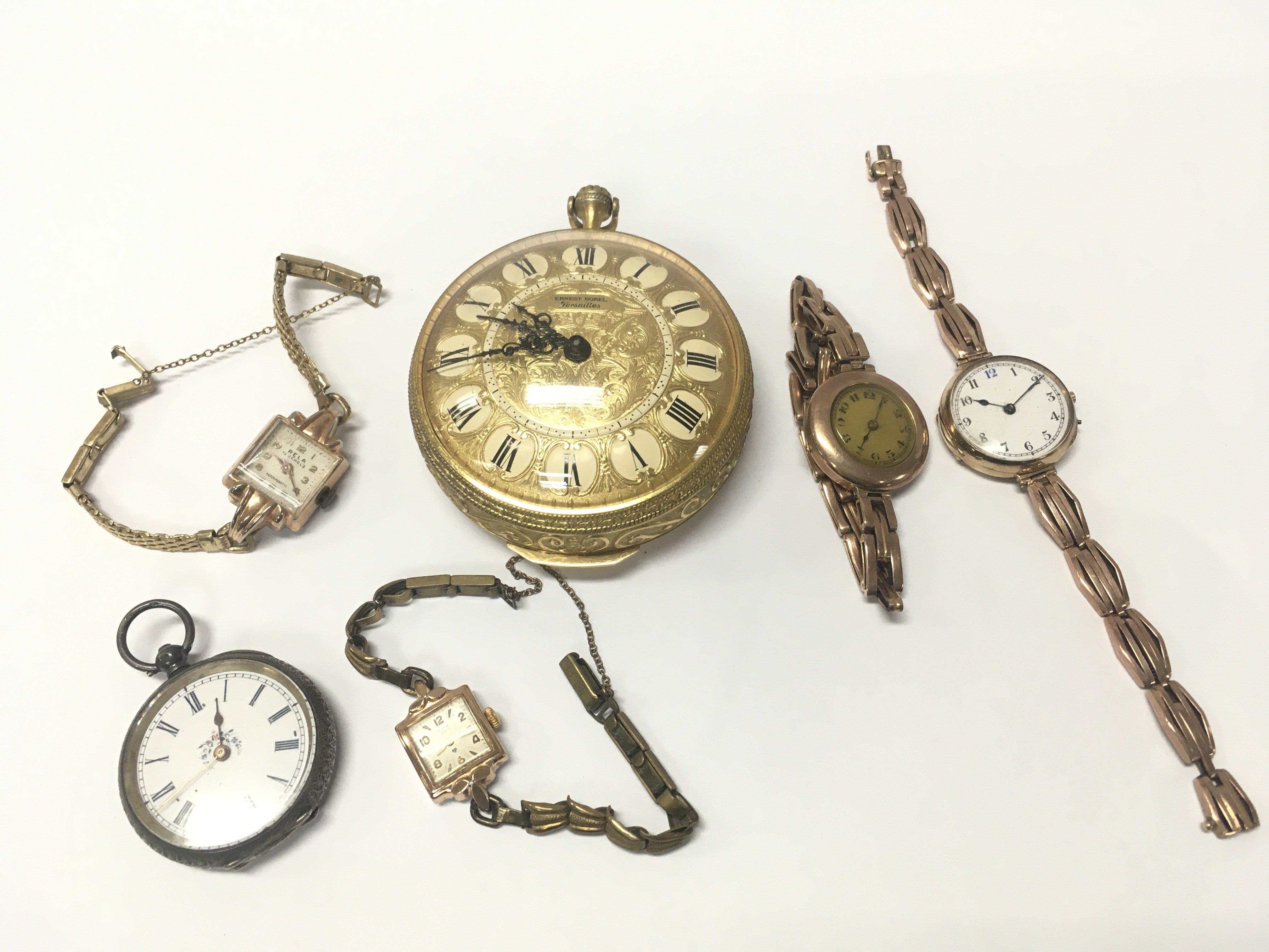 Four vintage watches including two 9 carat gold ladies watches , Ernest Borel Versailles 8 day oversized pocket watch, small silver cased pocket watch. This lot cannot be posted