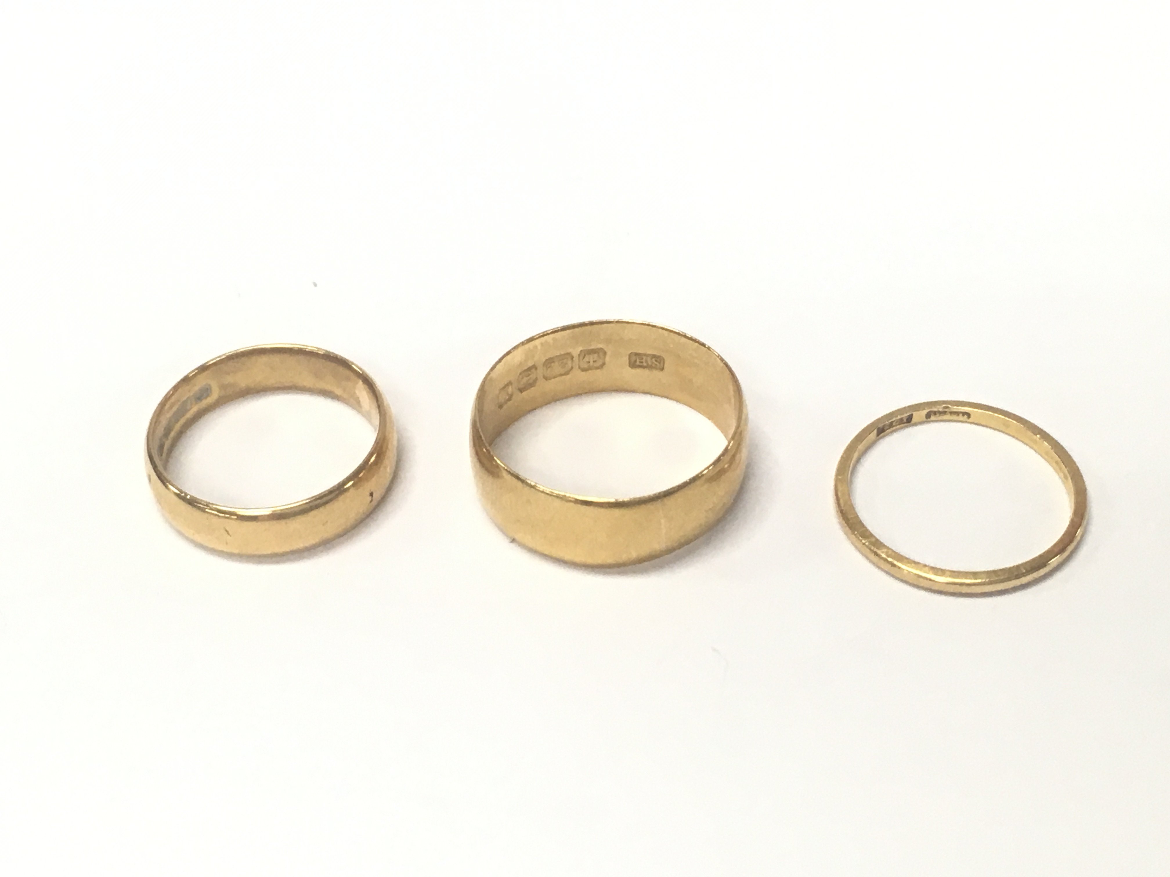 Three 22ct gold wedding bands. 12.17g