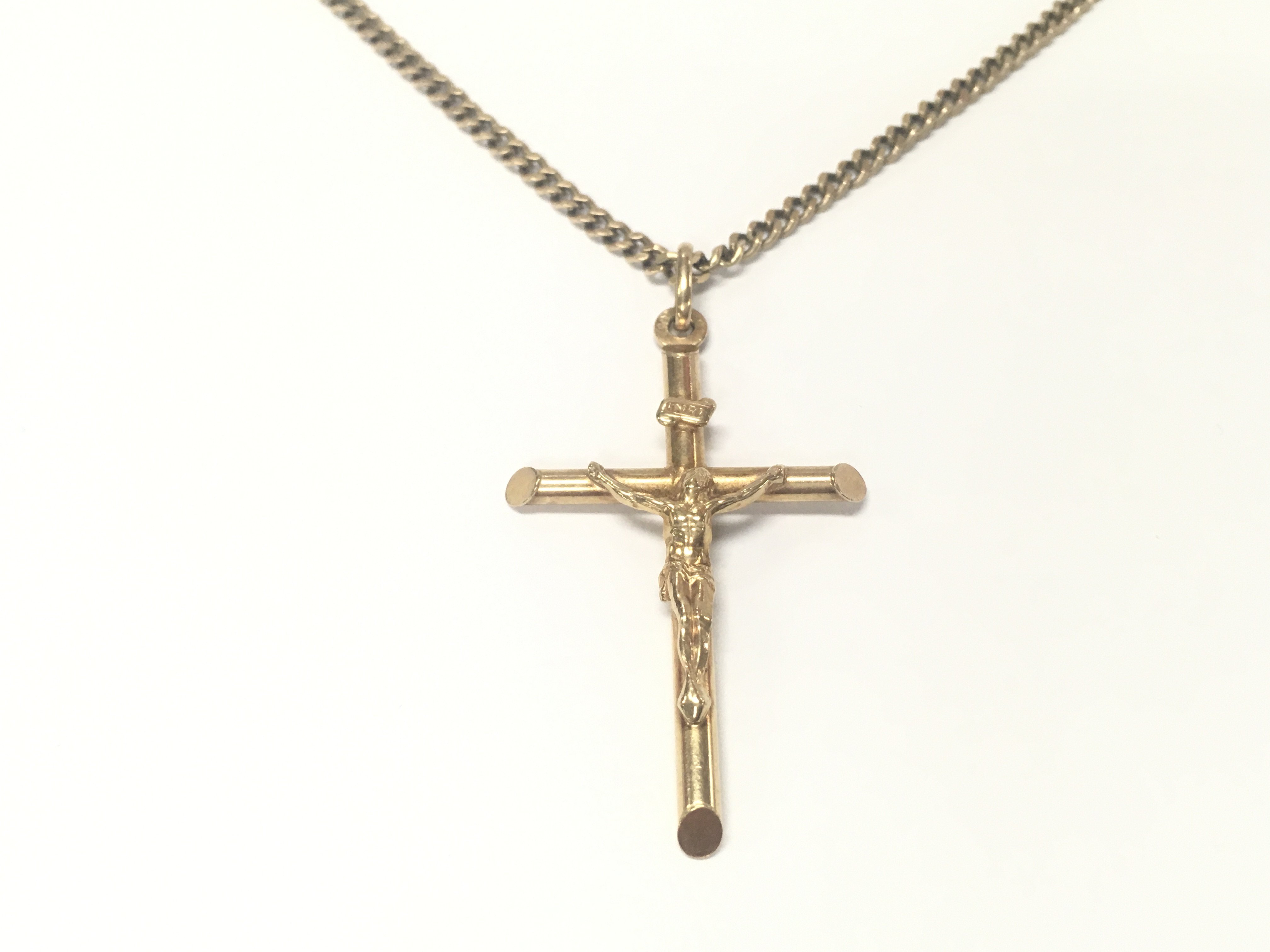 A 9ct gold crucifix and chain. 12.89g approximately.