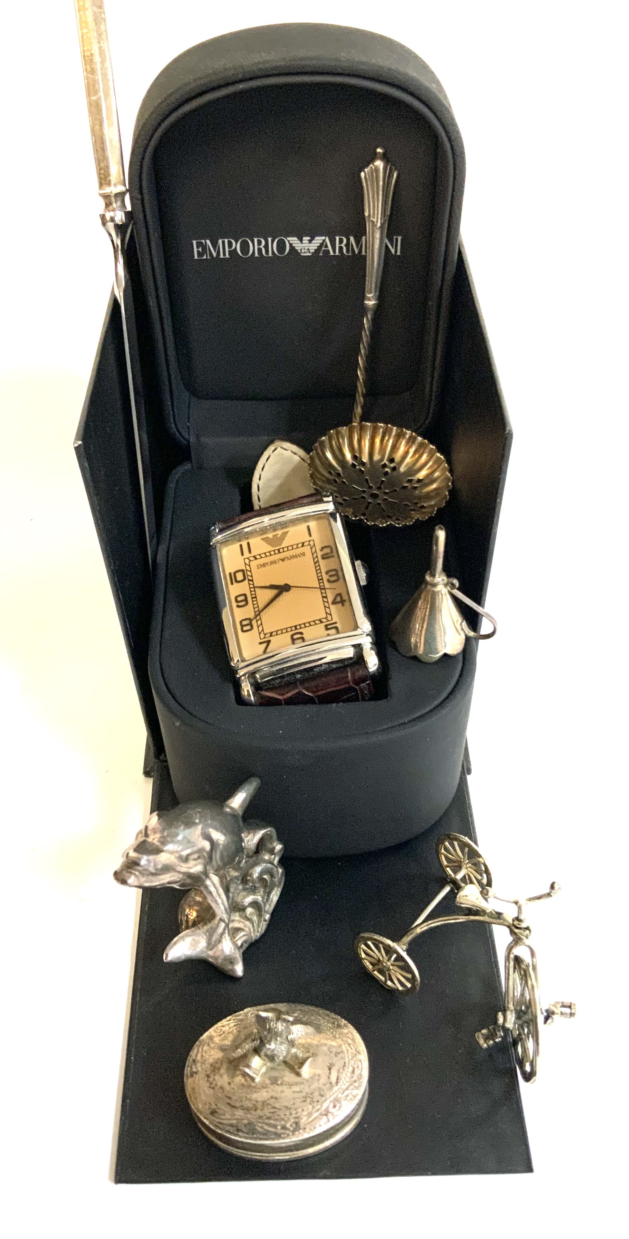 A small collection of sterling silver articles together with an Emporio Armani watch.