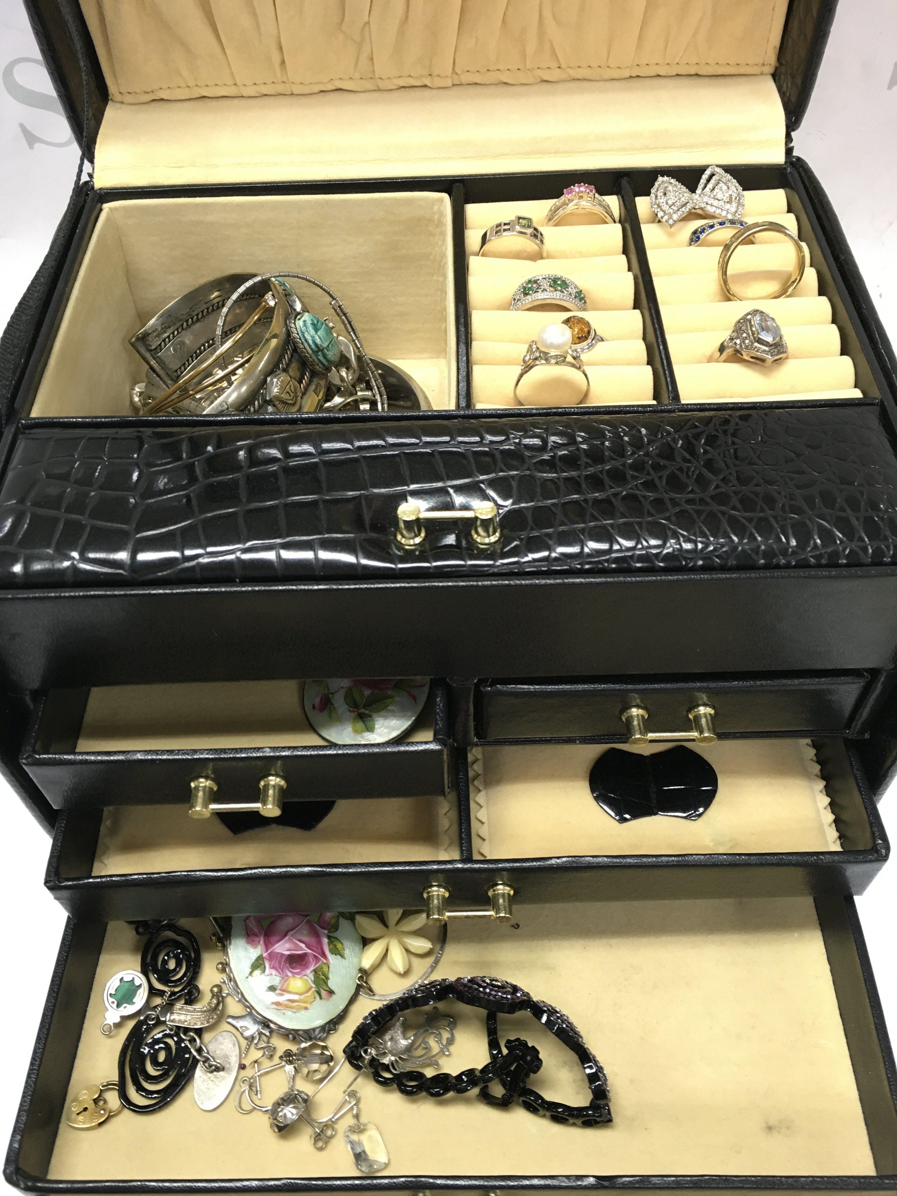 A Jewellery box of mainly silver jewellery including rings, bracelets etc