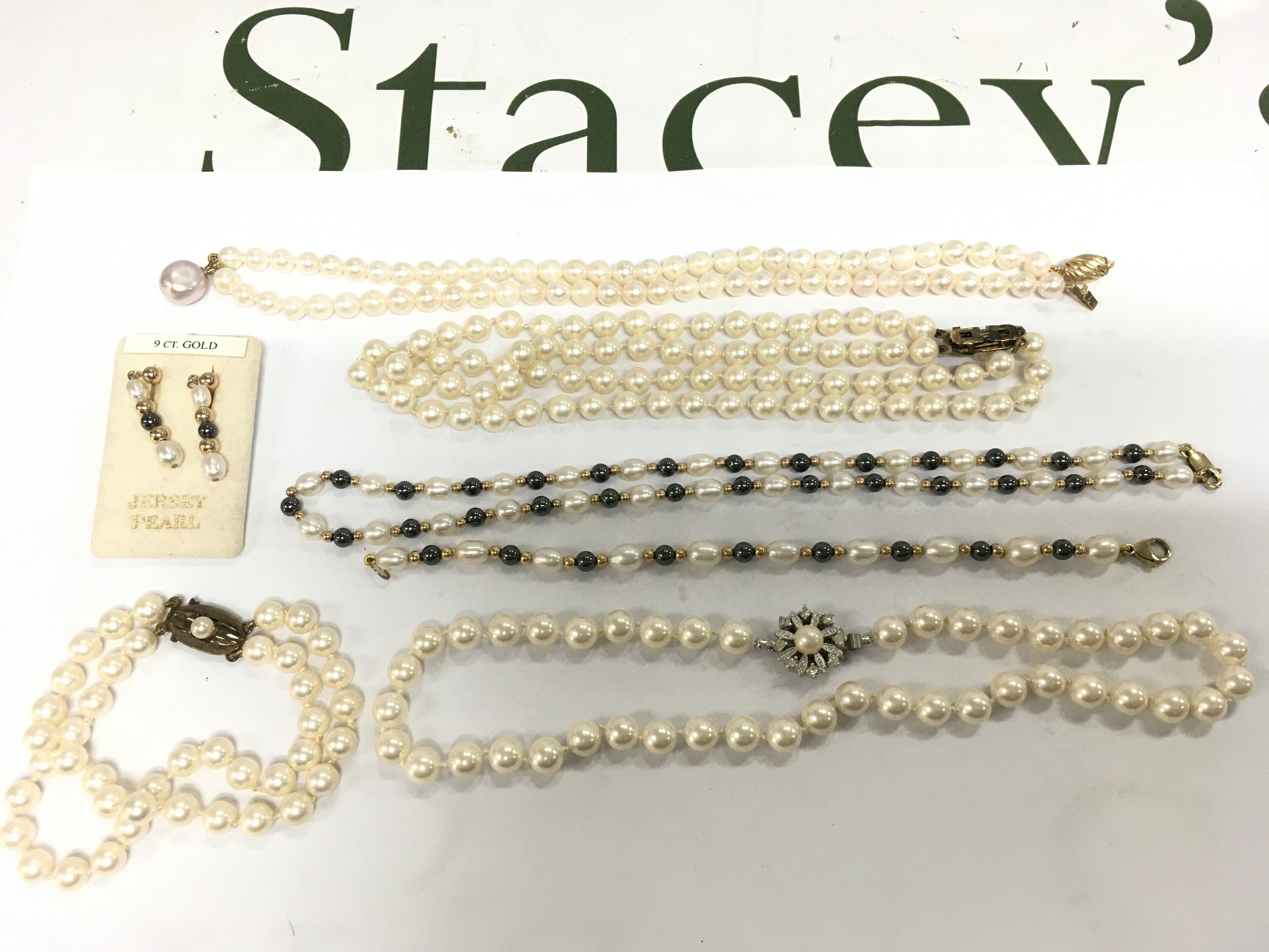 A small collection of pearl necklaces, some with gold clasps. Shipping category A.
