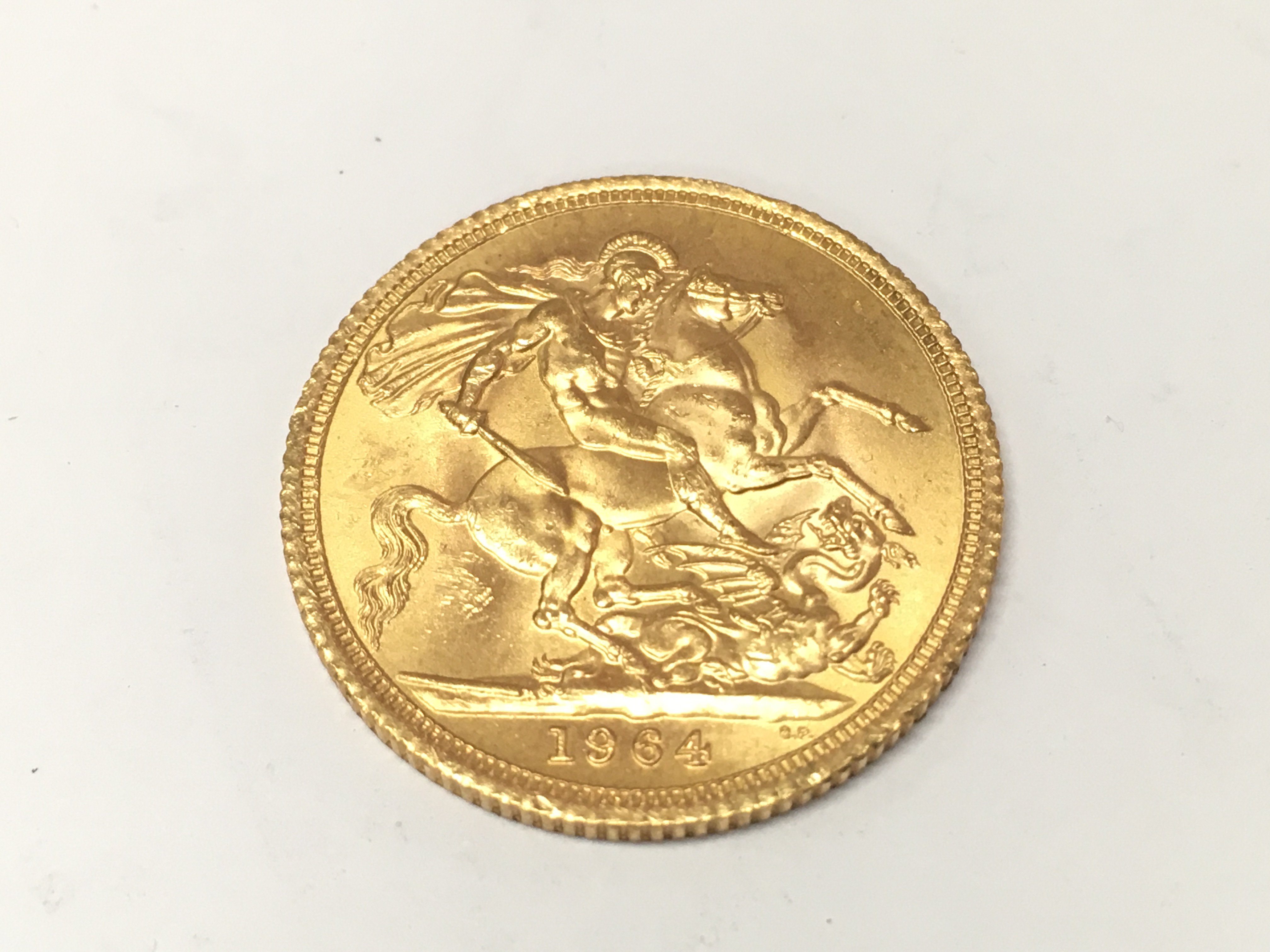 A 1964 full gold sovereign.