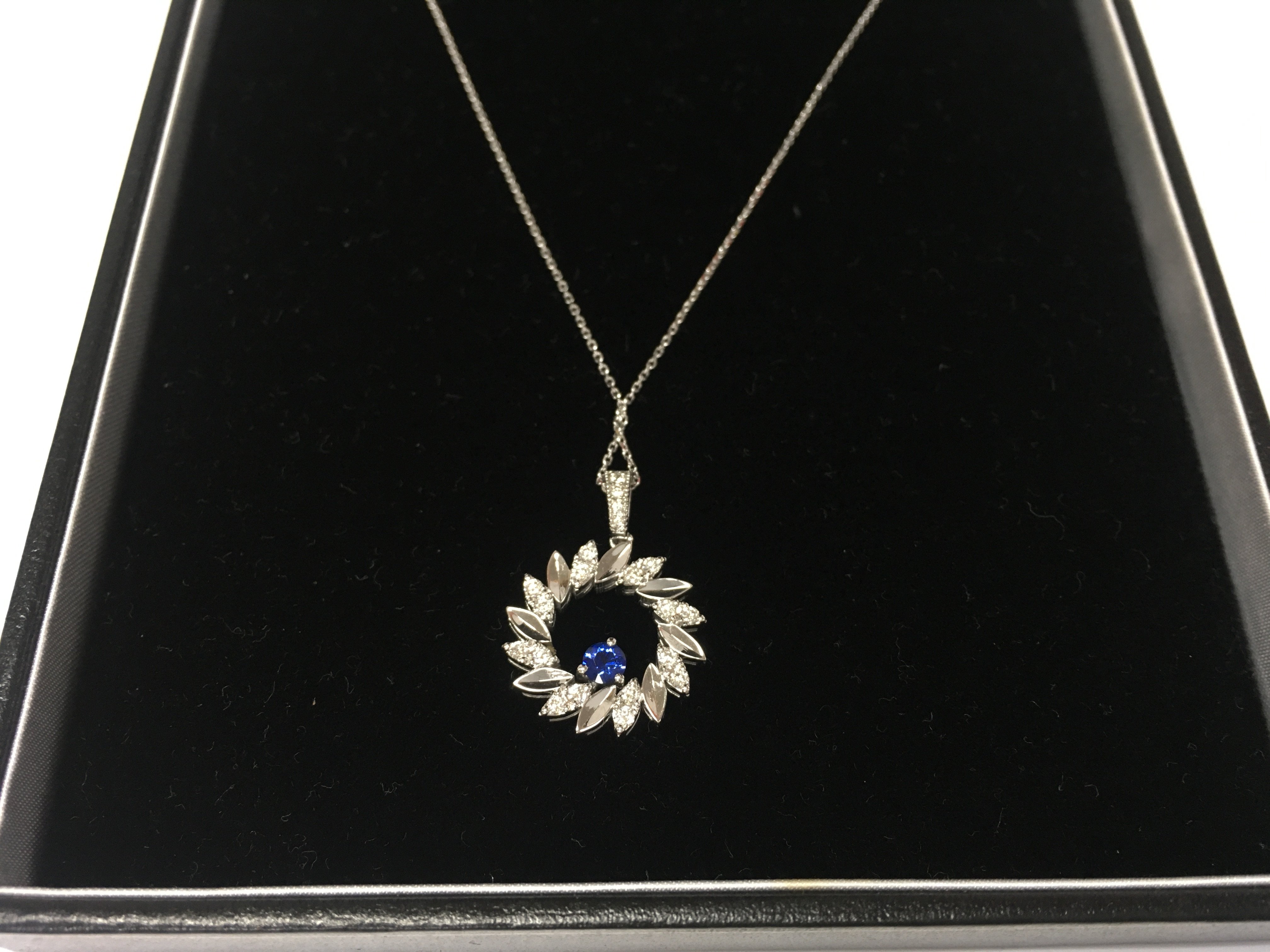 A 14ct white gold diamond and sapphire necklace. Approximately 3.80g
