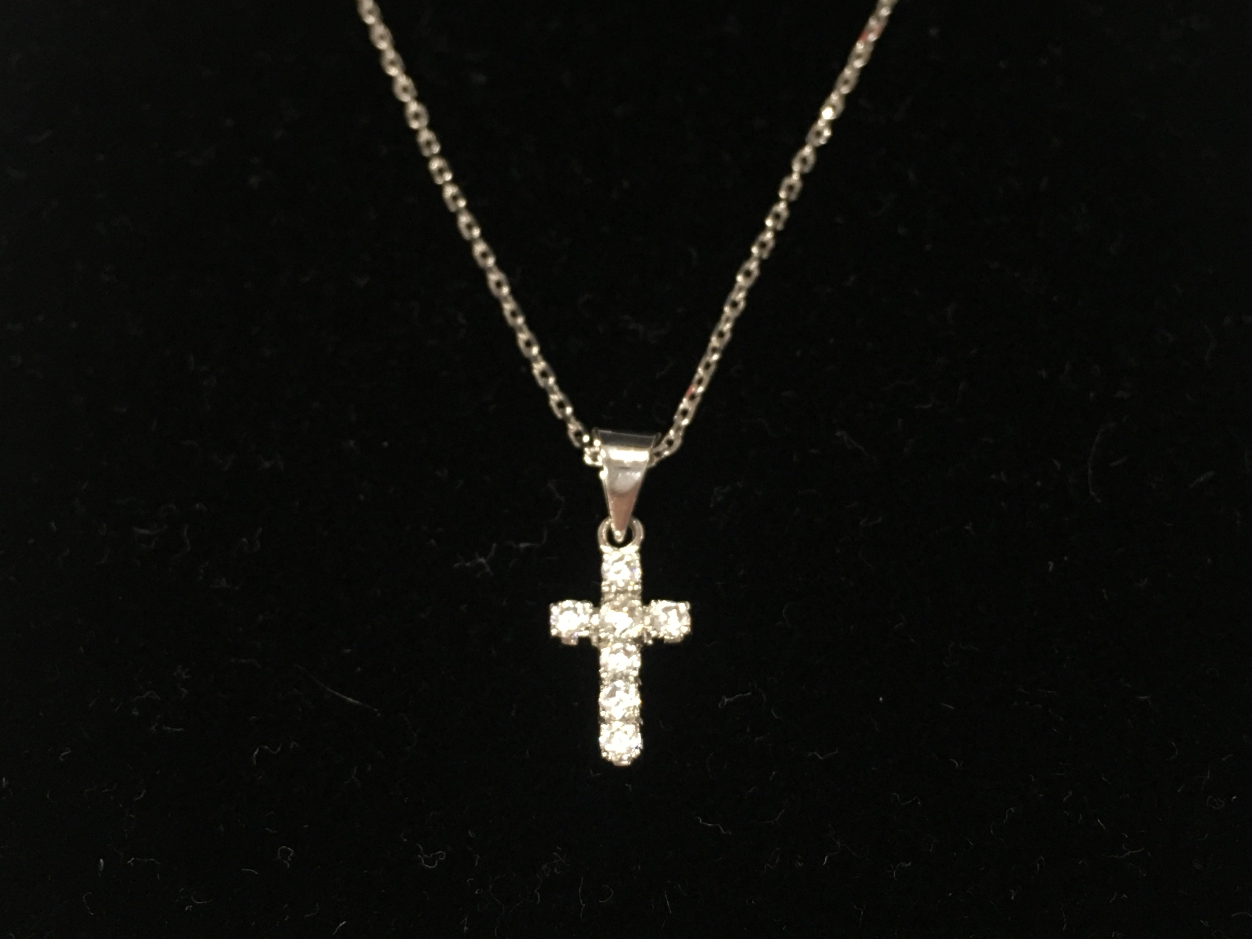 An 18ct white gold diamond cross pendant and chain. 3.62g
