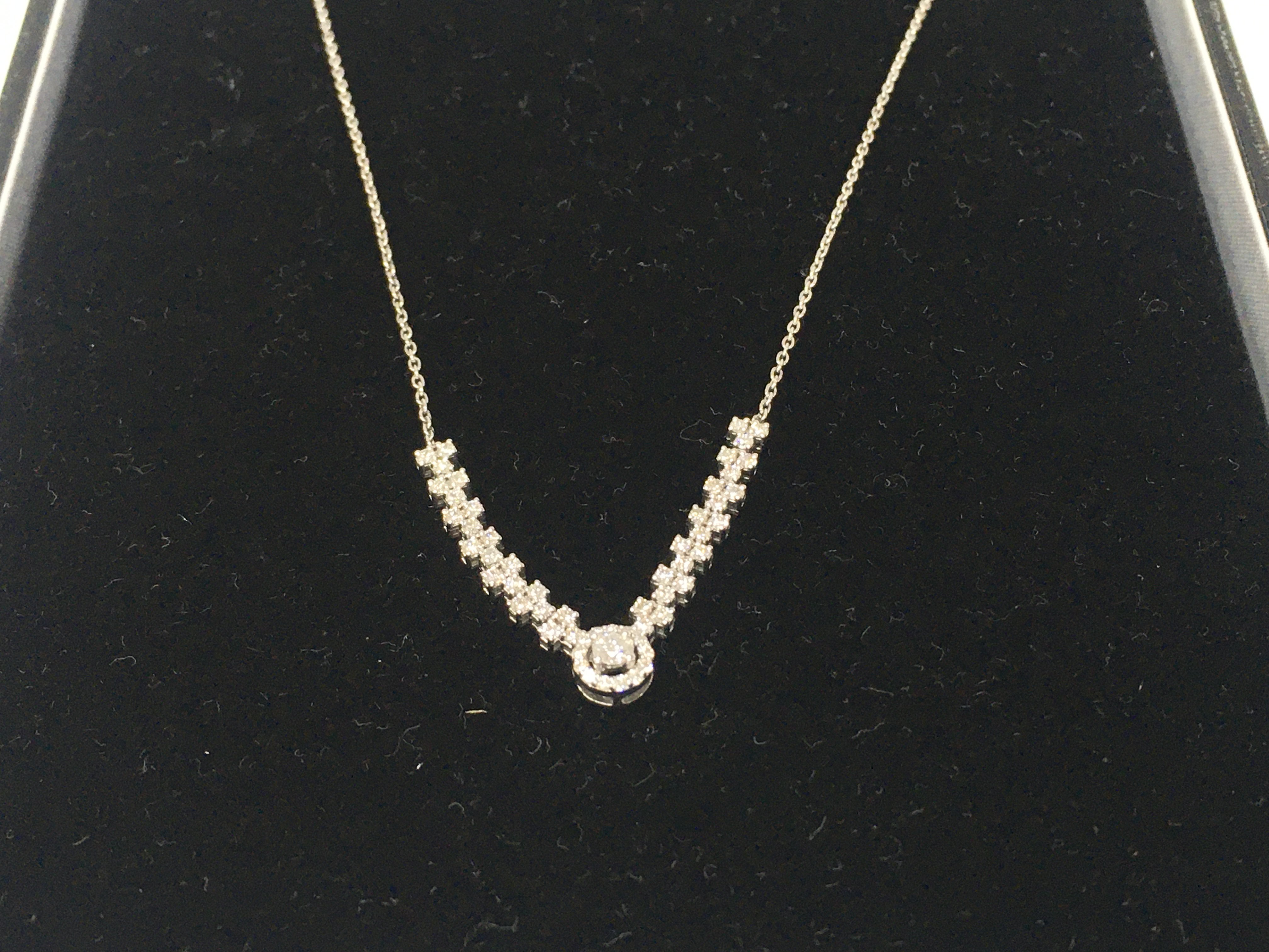 A 14ct white gold diamond necklace. Approximately 3.40g