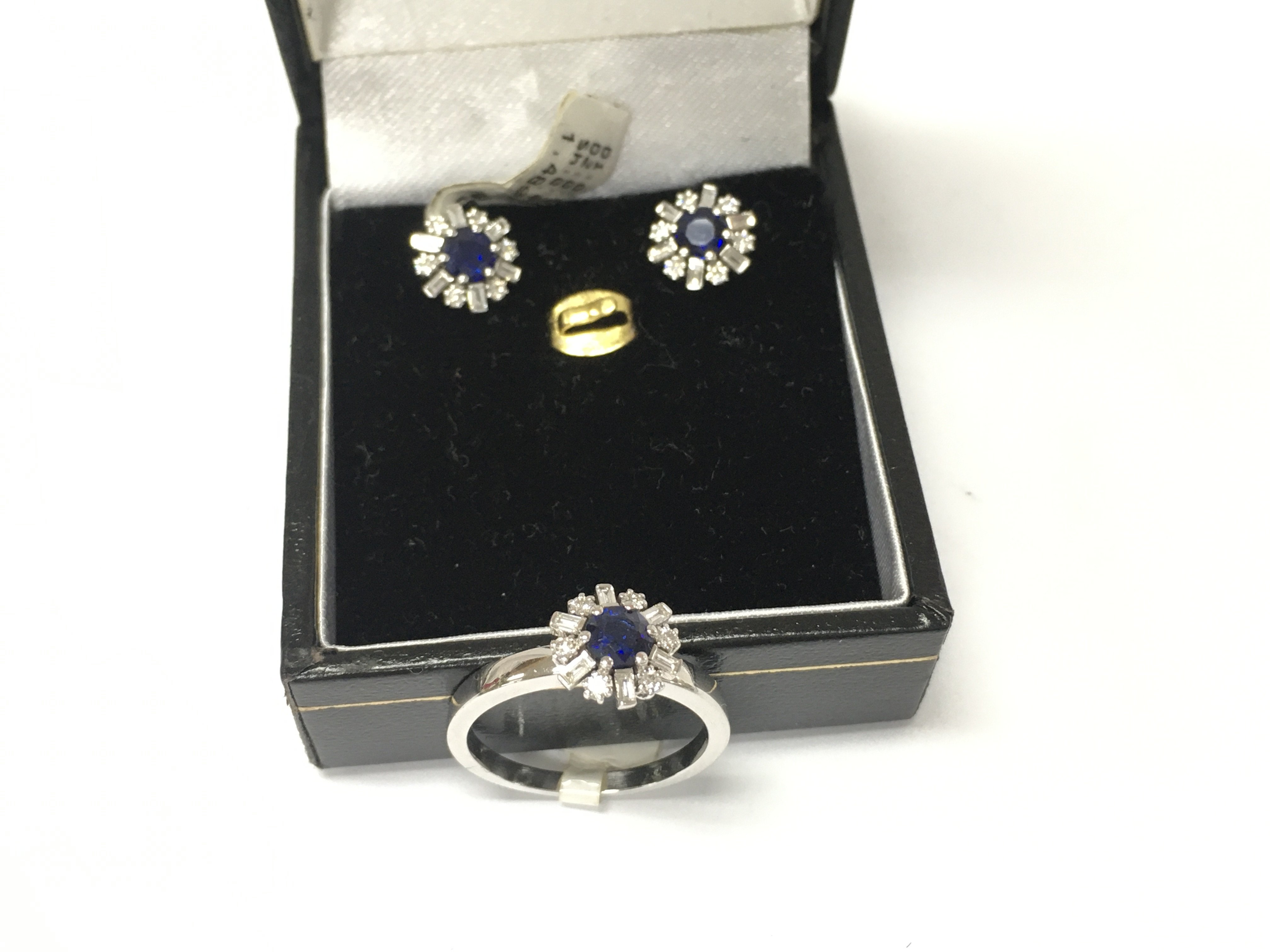 A 14ct white gold diamond and sapphire ring with matching earrings. Size M