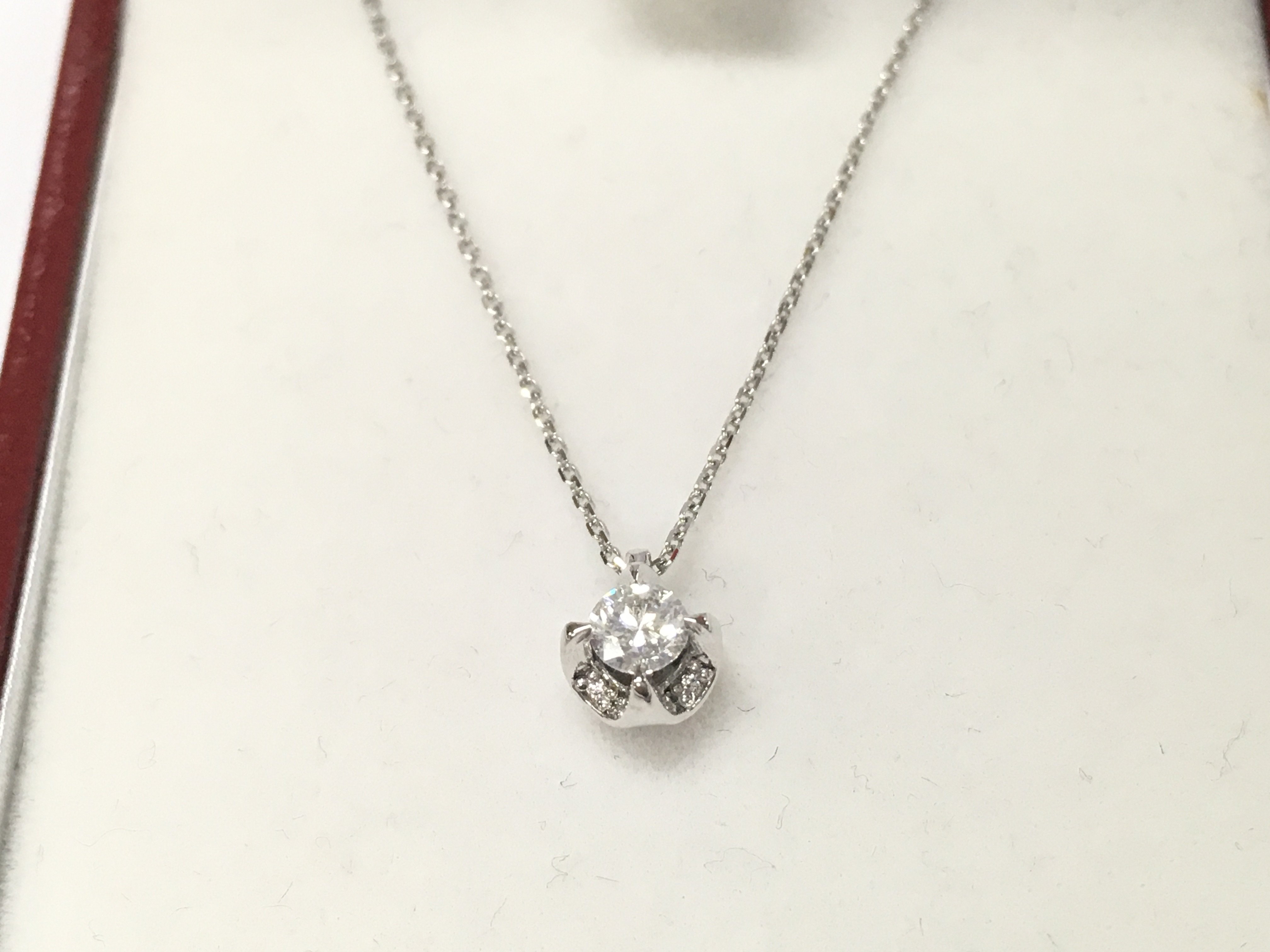 A 14ct white gold diamond solitaire necklace.