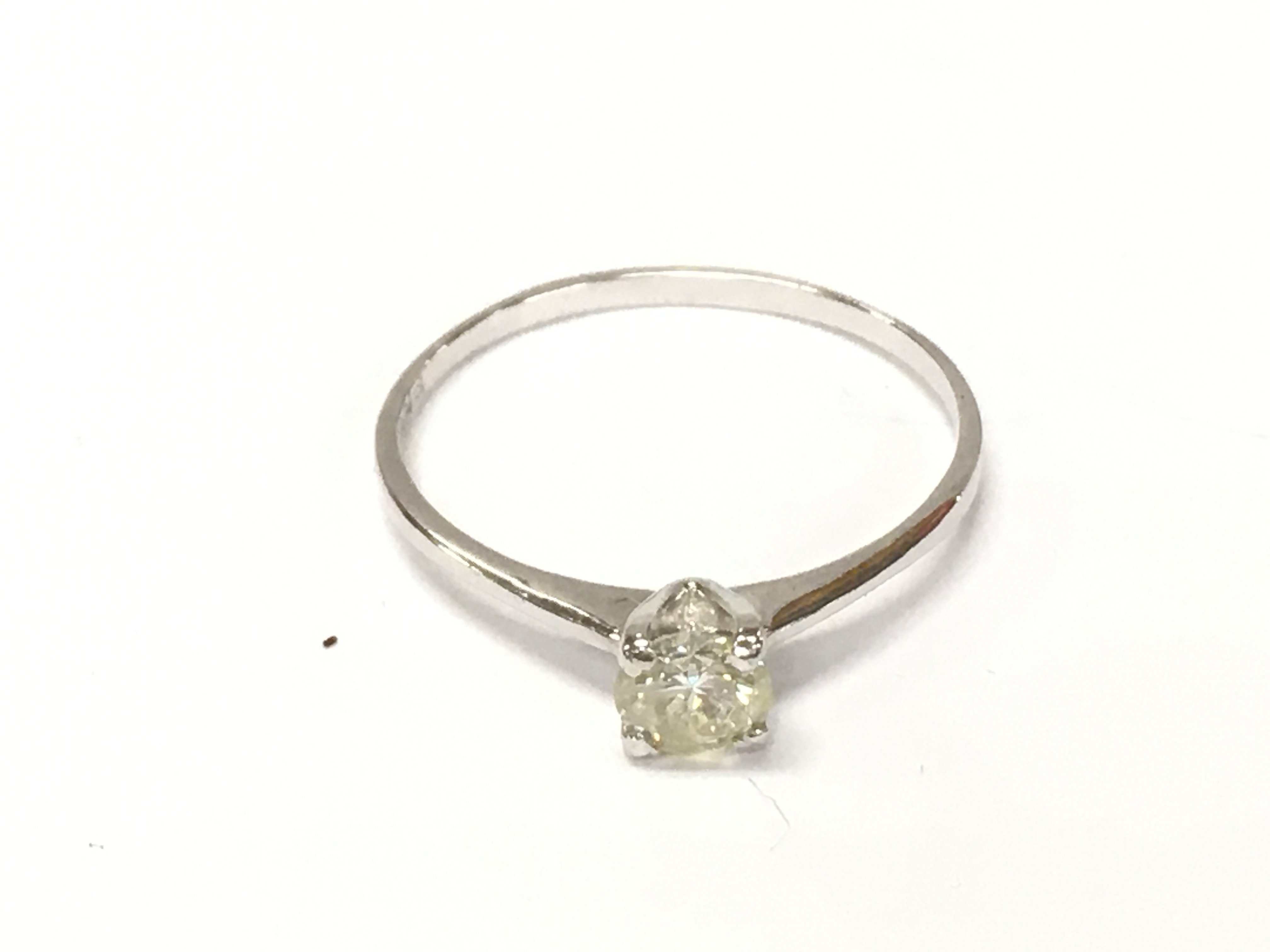14ct white gold diamond solitaire ring. Size N approximately 0.90g and 0.34ct