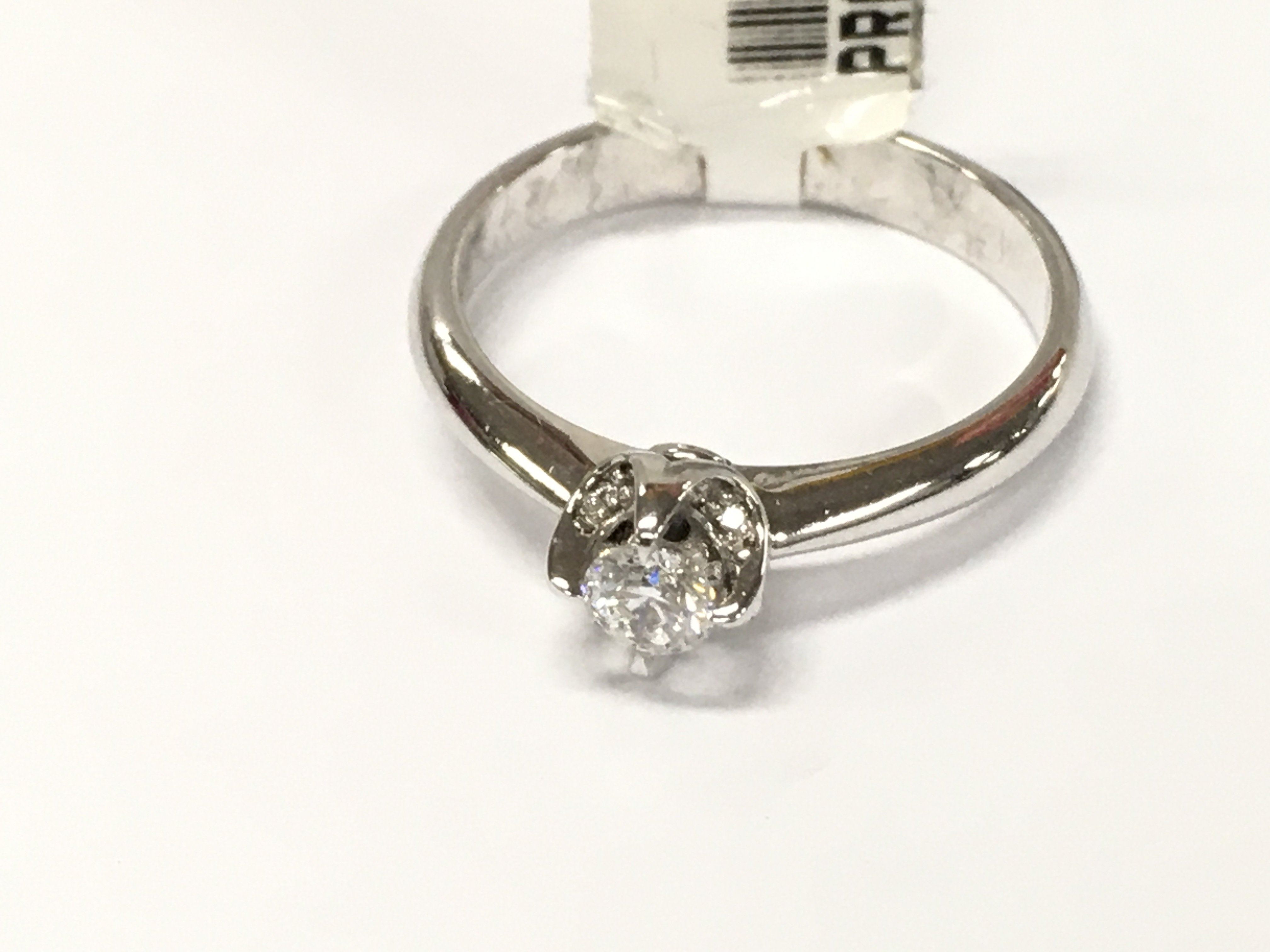 14ct white gold diamond solitaire ring. Size N and 0.23ct