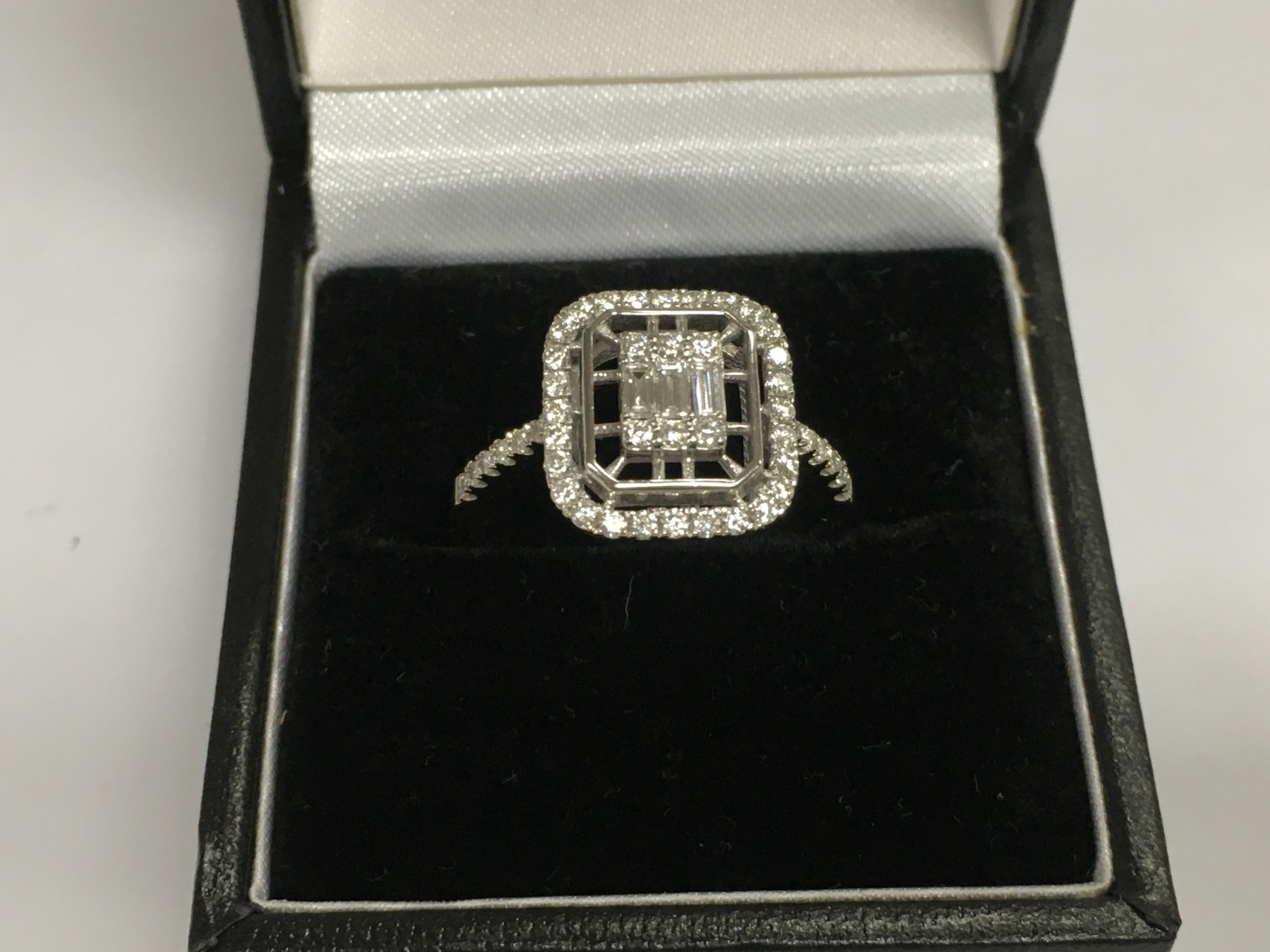 A 14ct white gold diamond cluster ring, approx 3.5g and approx size M-N. Shipping category A.