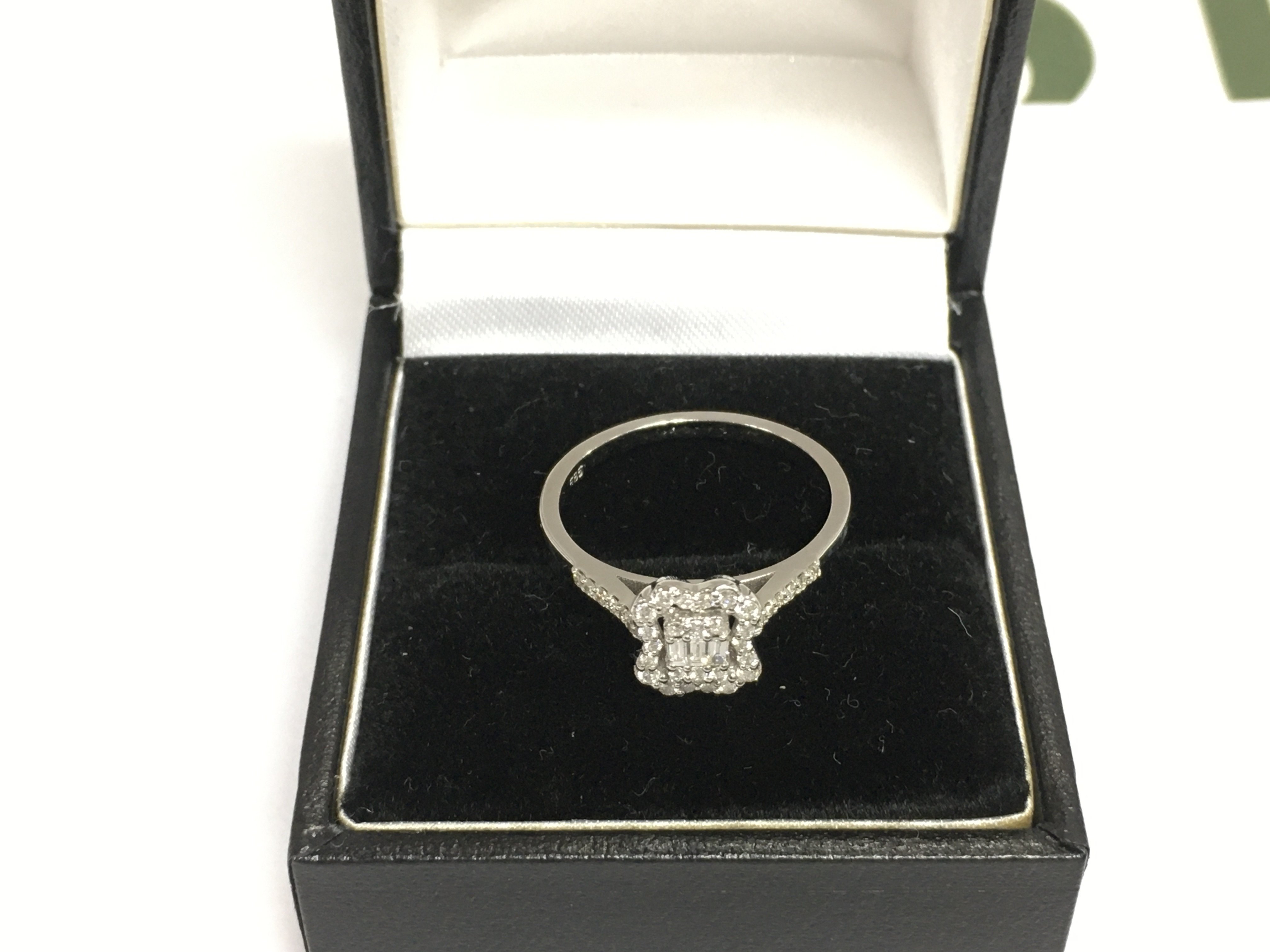 A 14ct white gold diamond cluster ring, approx 2.1g and approx size M-N. Shipping category A.