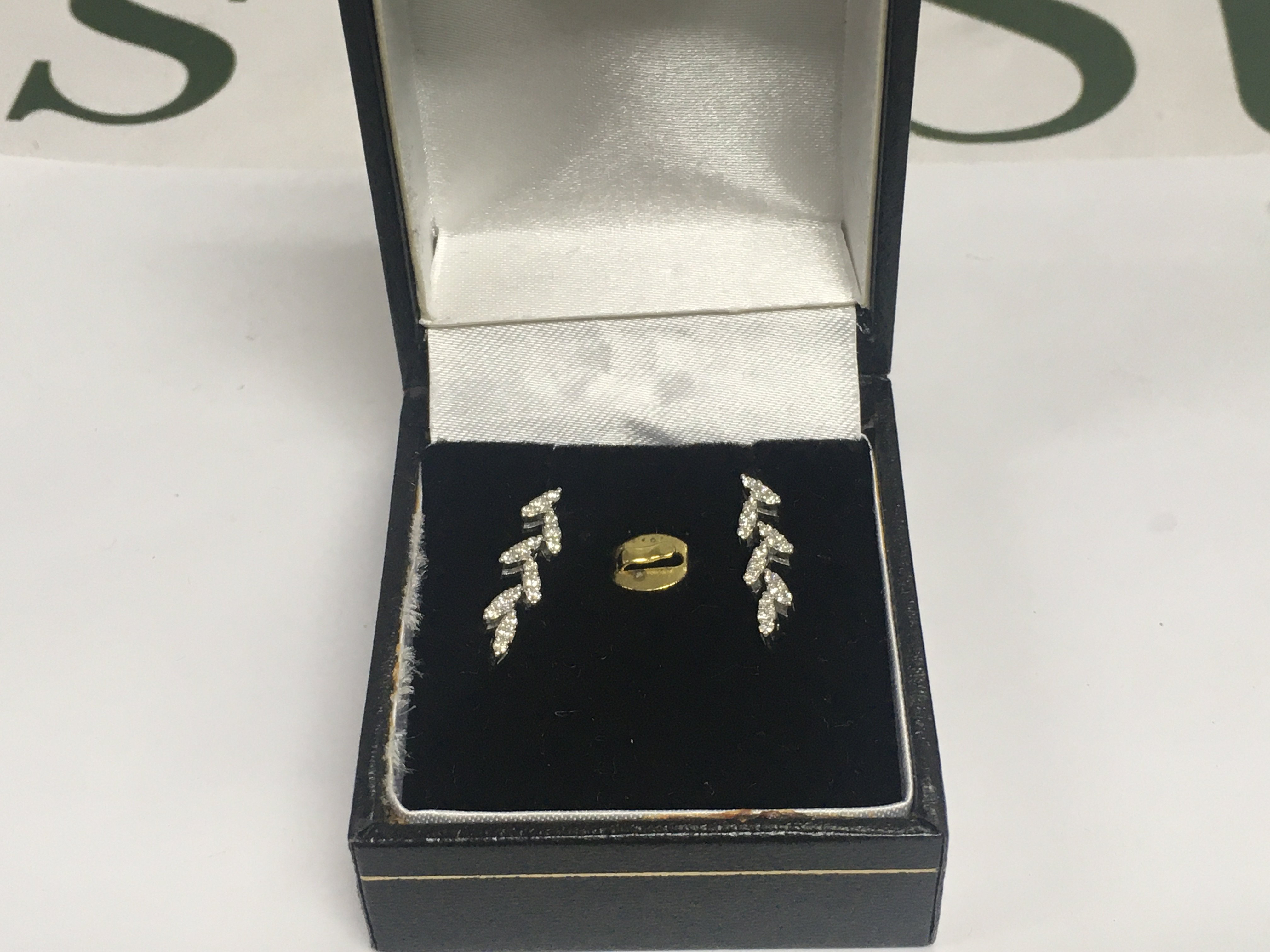 A pair of 14ct white gold diamond cluster rings, approx 1.9g. Shipping category A.