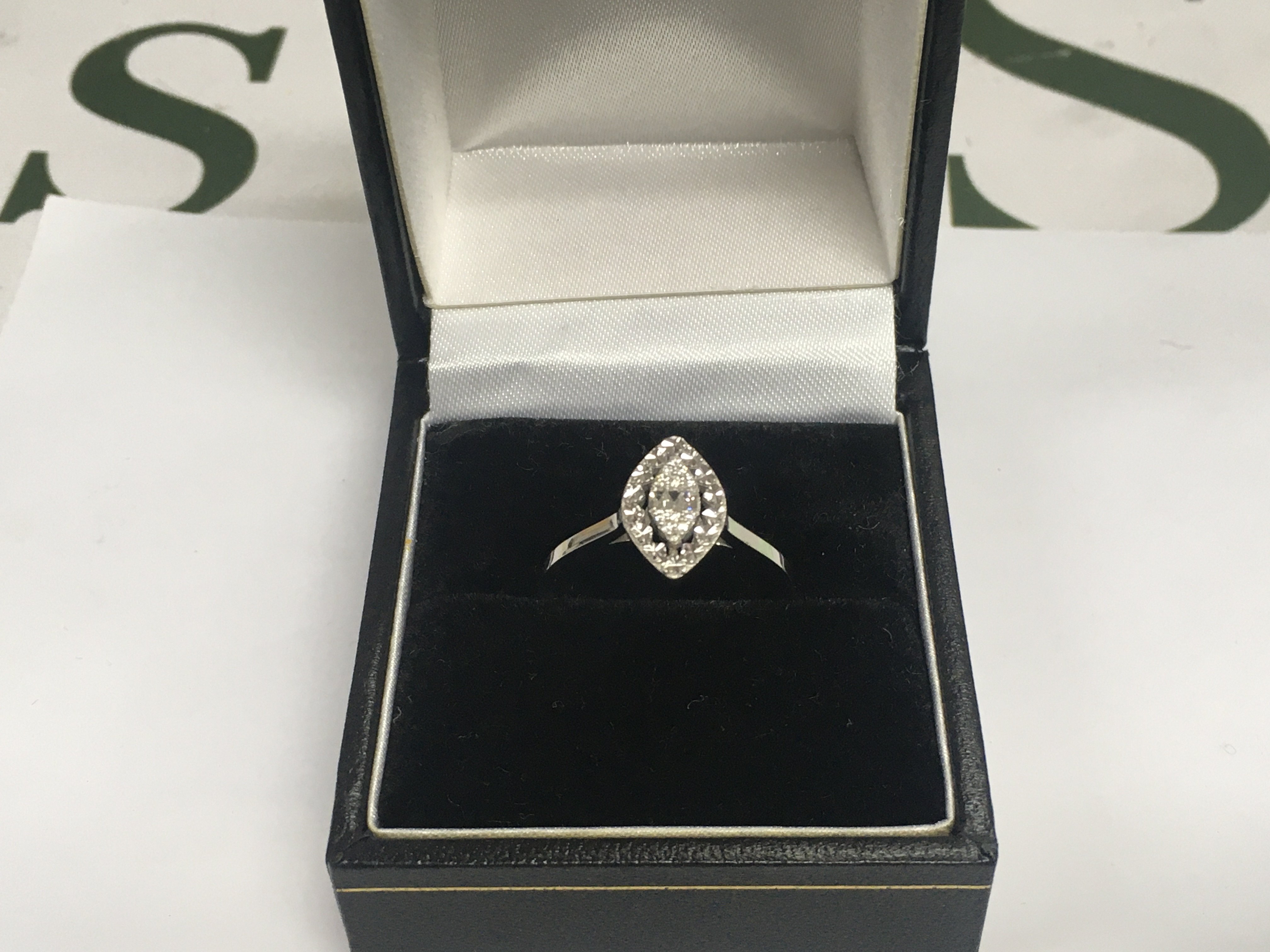A 14ct white gold diamond cluster ring, approx 1.9g and approx size N. Shipping category A.