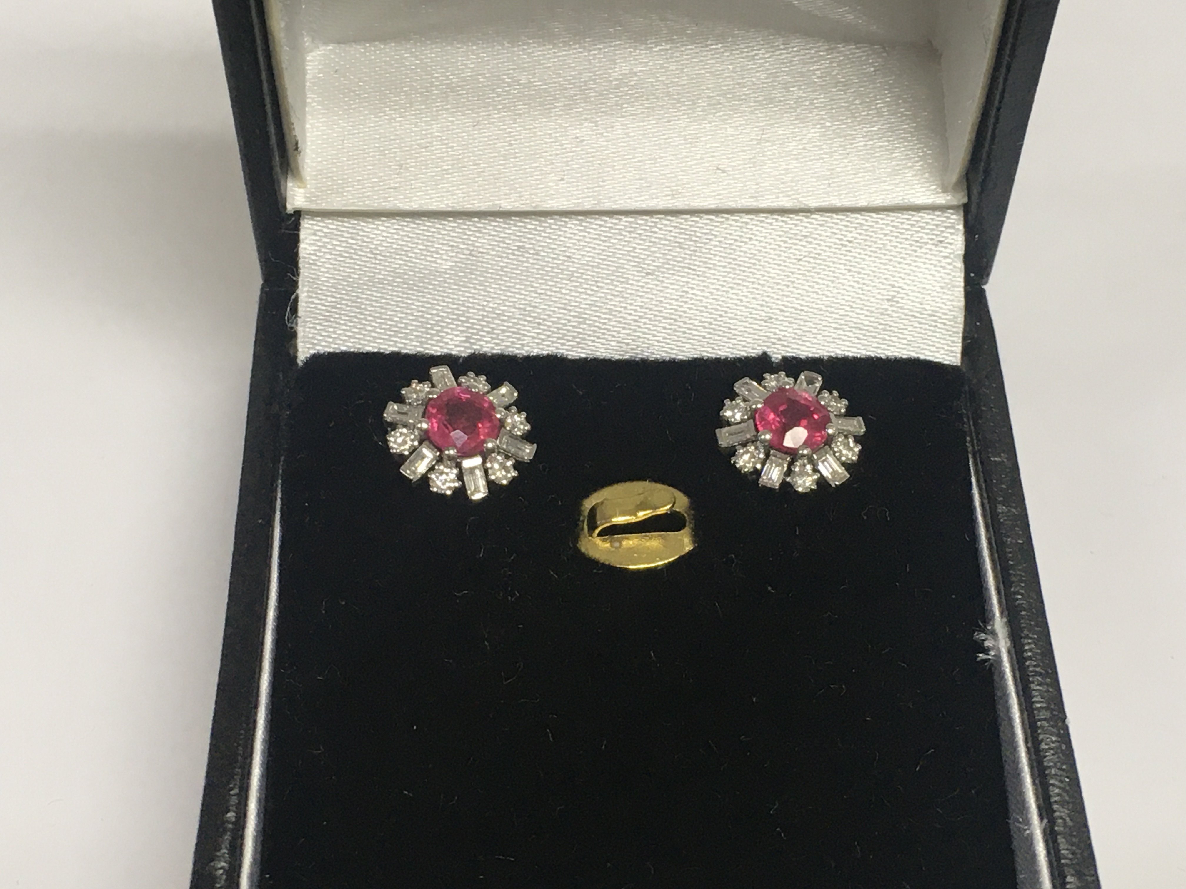 A pair of 14ct white gold, ruby and diamond ear studs, approx 1.8g. Shipping category A.