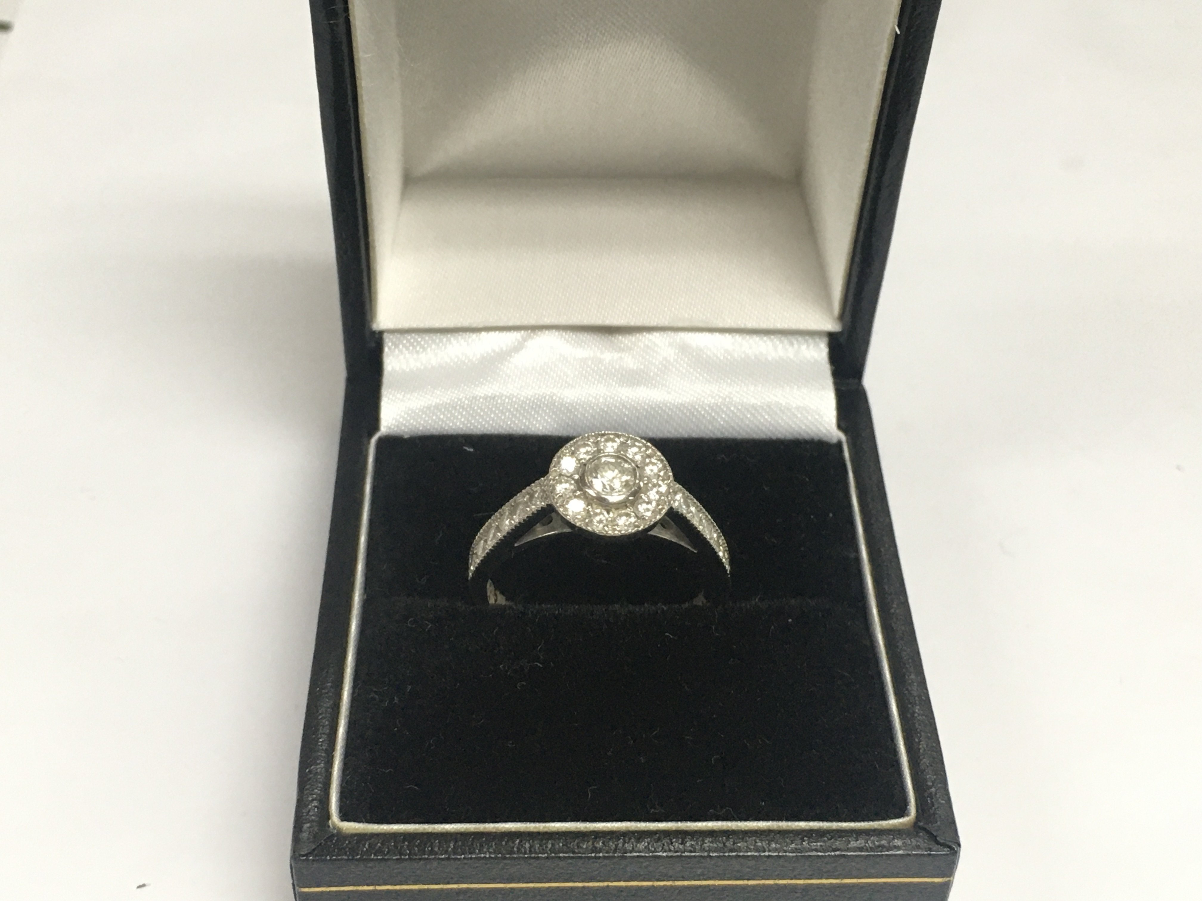 An 18ct white gold diamond ring, approx 4g and approx size L. Shipping category A.