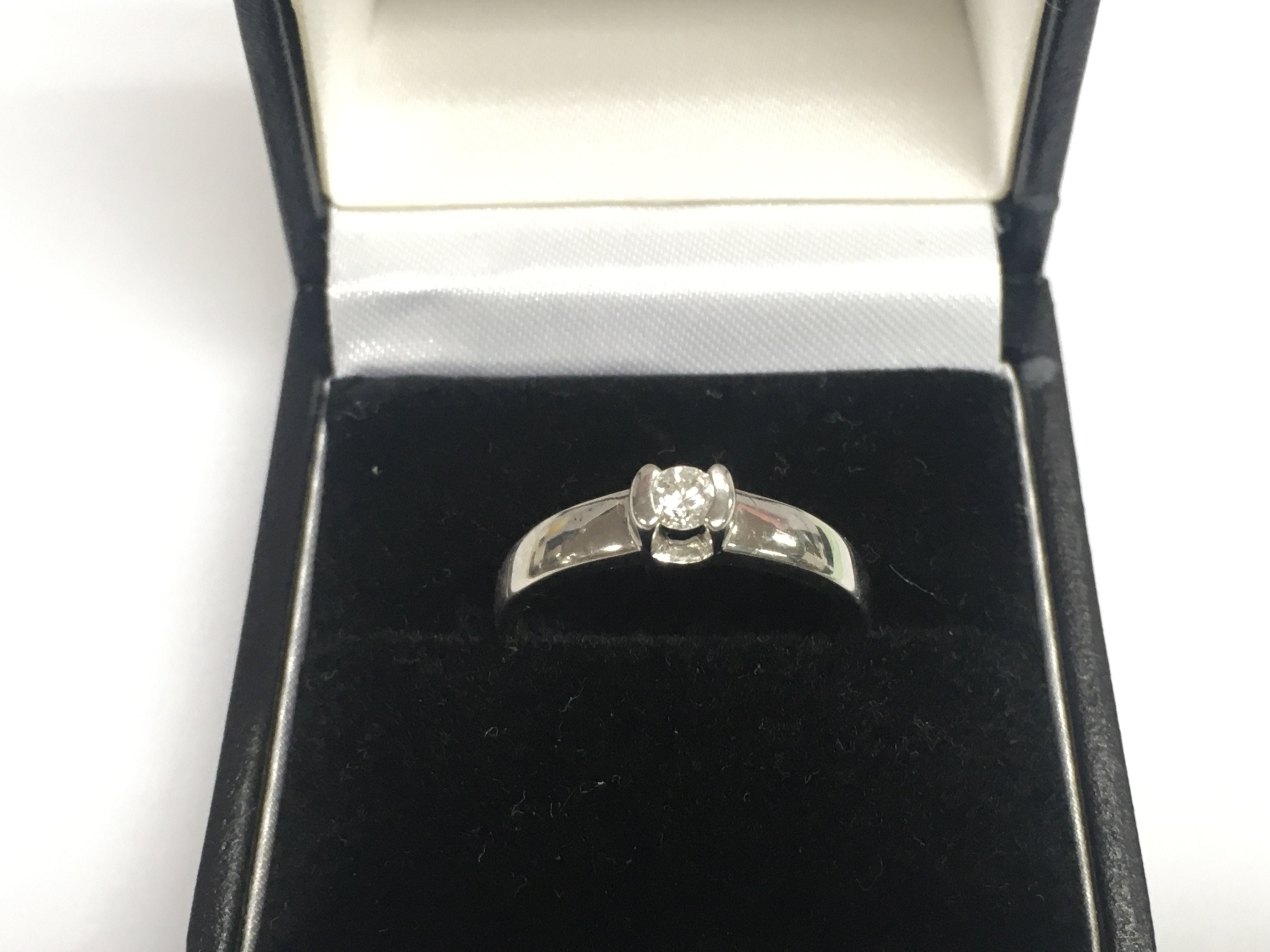An 18ct white gold diamond solitaire ring, approx 2.3g and approx size M-N. Shipping category A.
