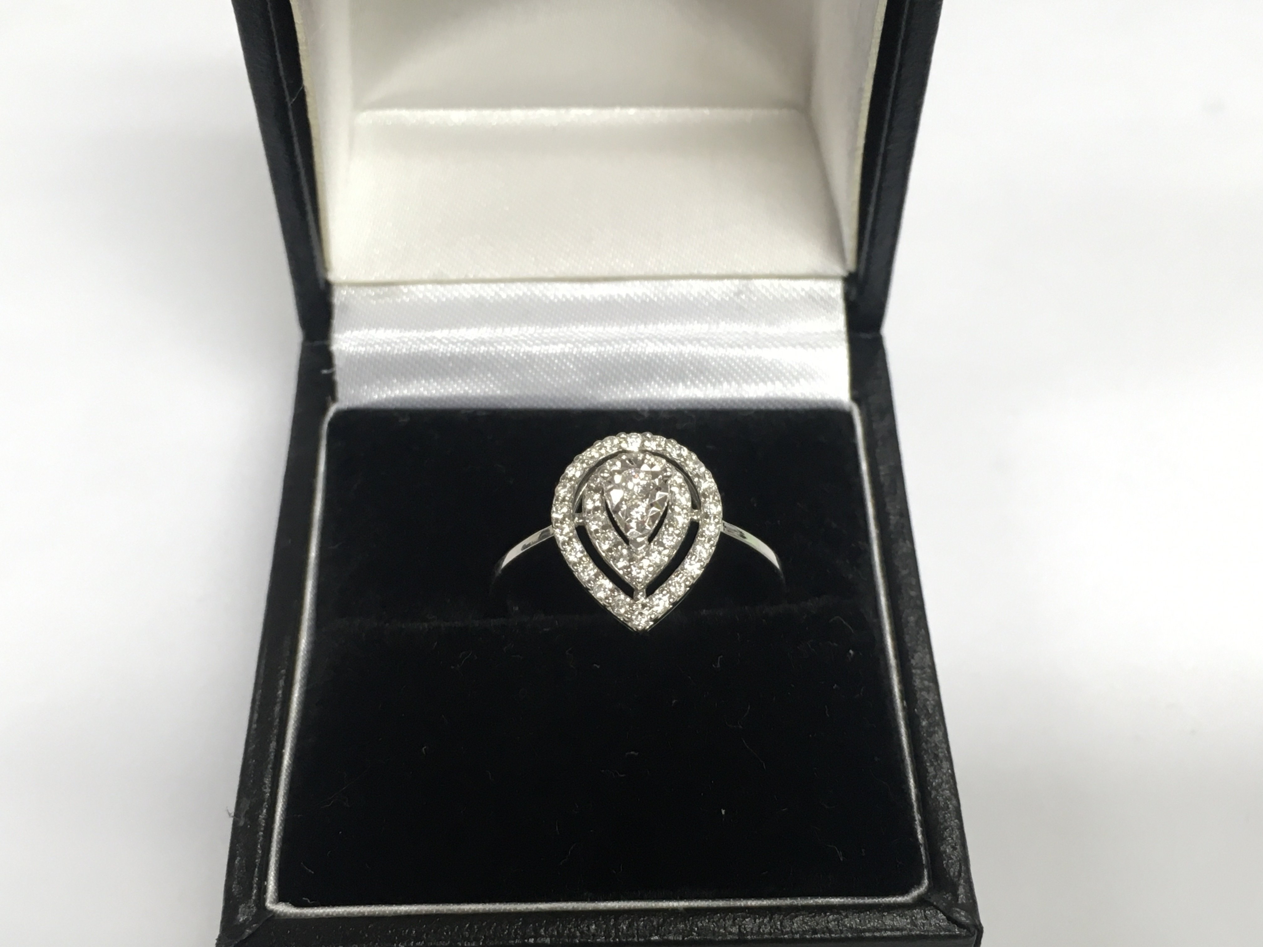 A 14ct white gold diamond cluster ring, approx 2.4g and approx size N. Shipping category A.