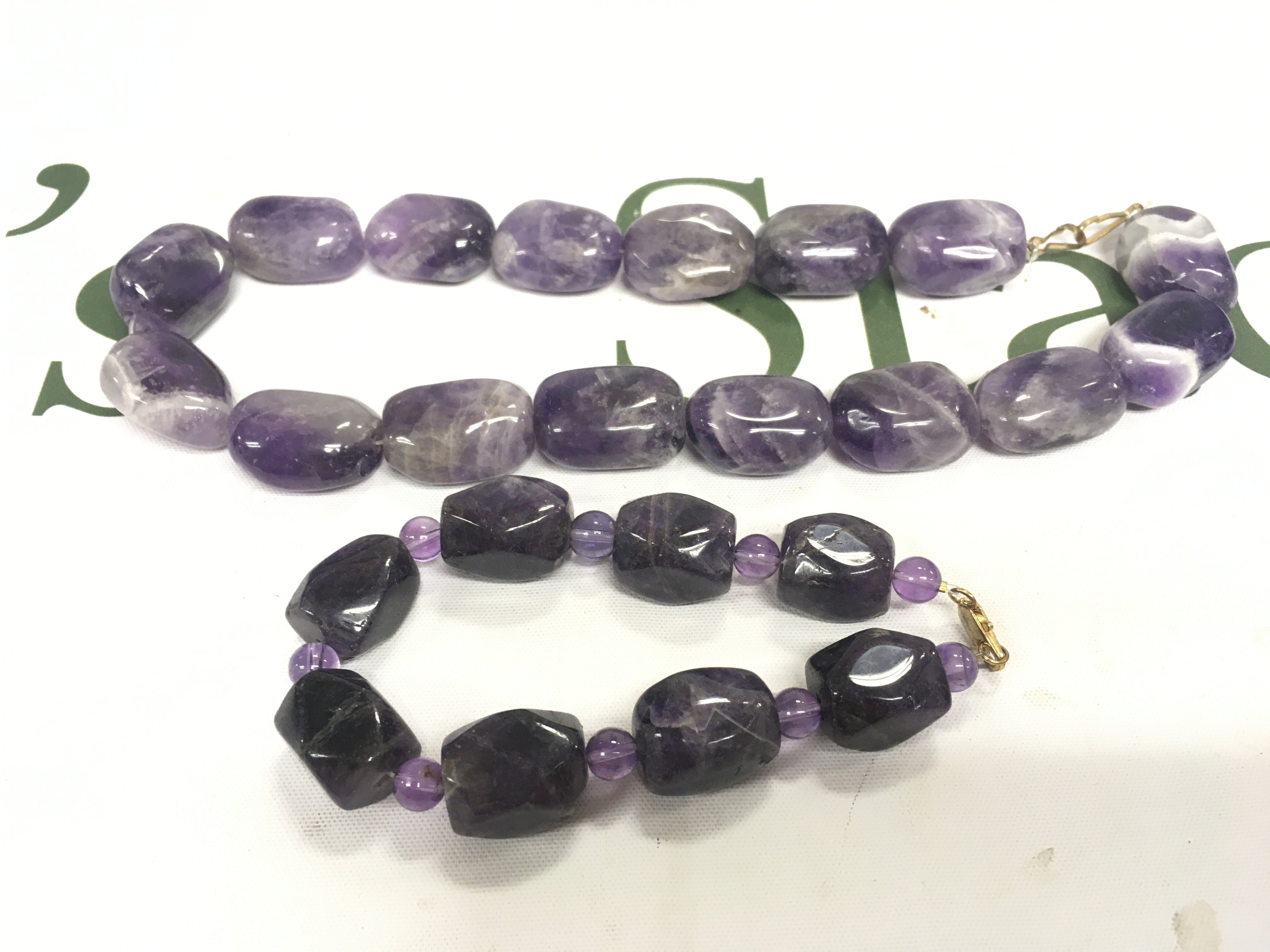 An amethyst bead bracelet and necklace set.