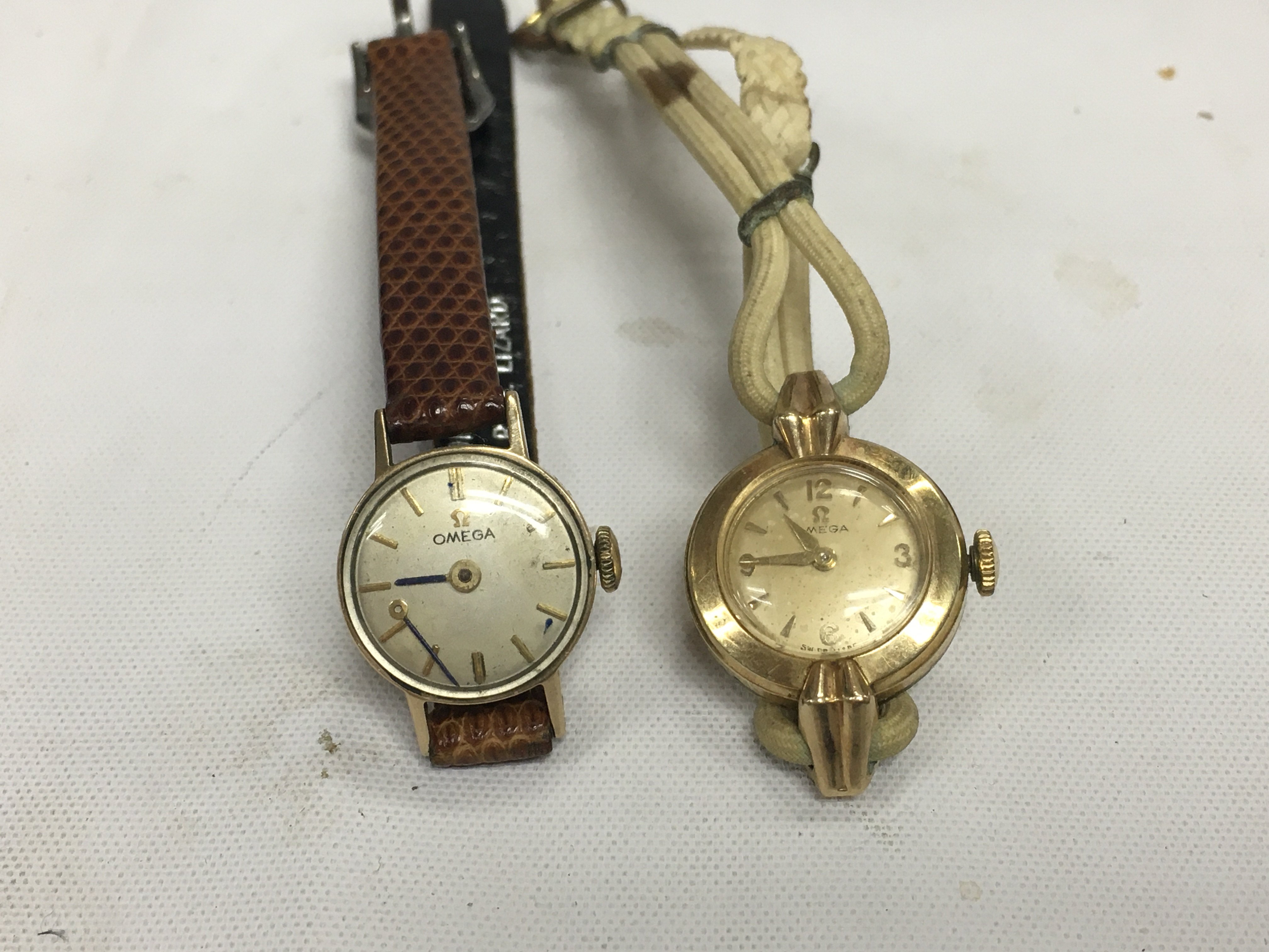 Two vintage ladies gold omega watches.
