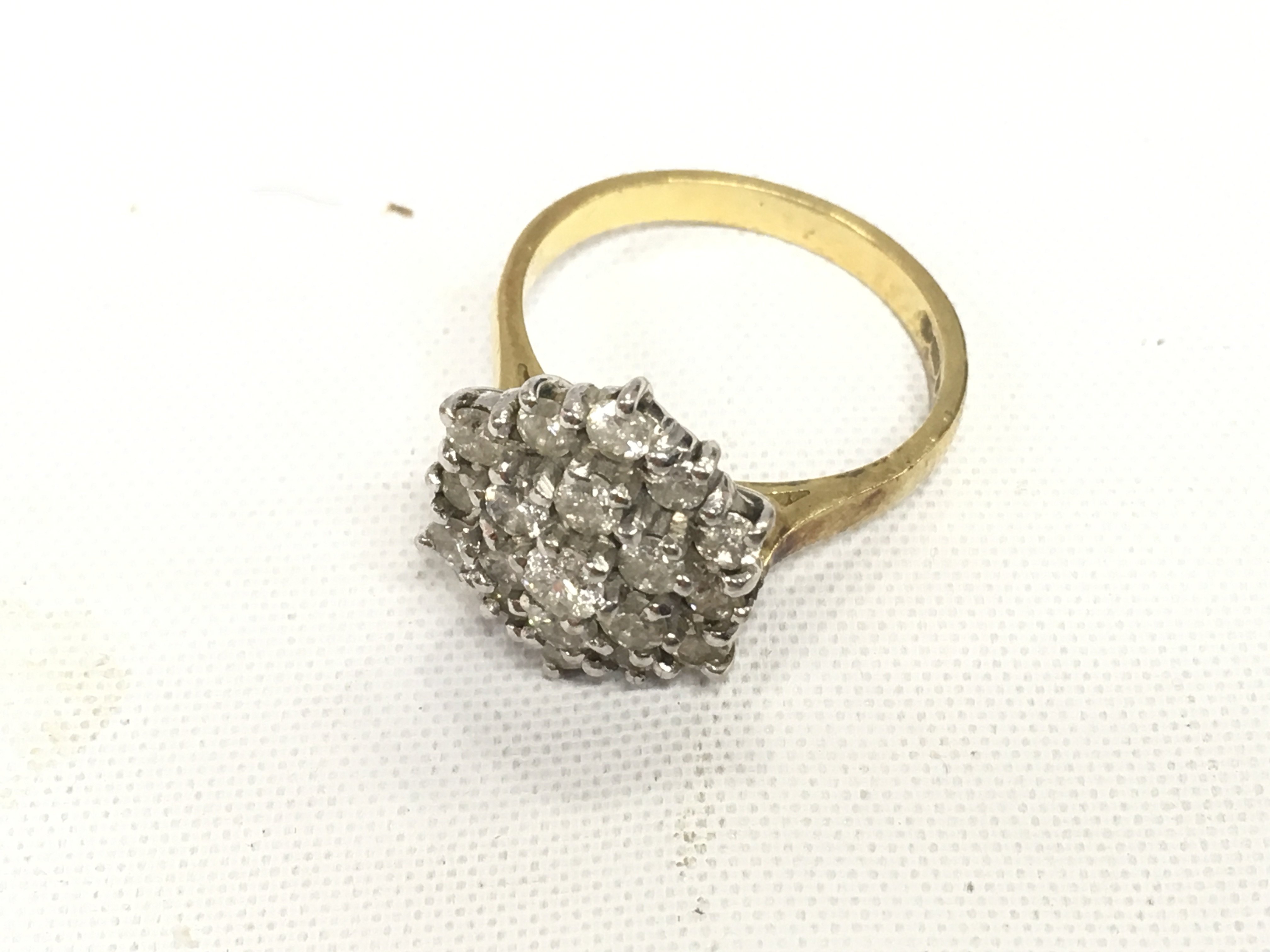 A. 18ct gold diamond cluster ring. Approx weight 5.58 grams, size O.
