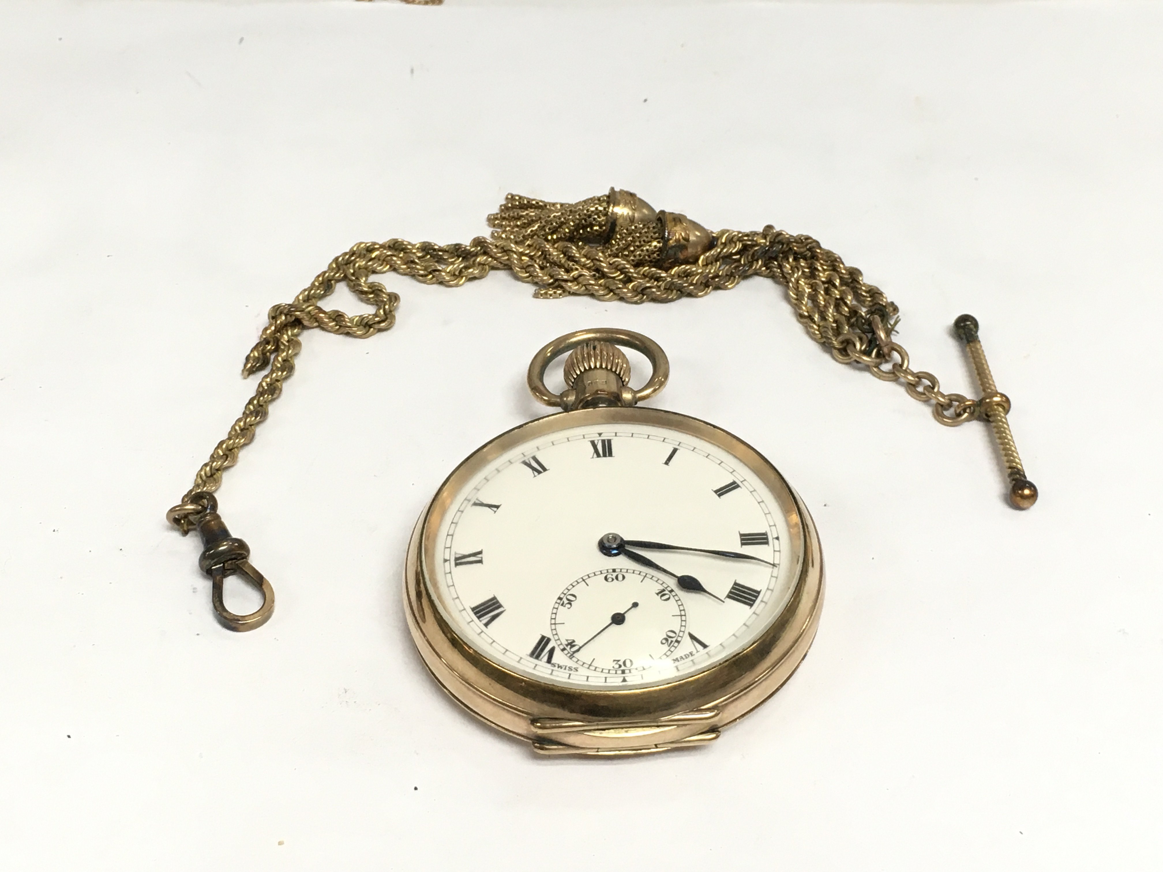 A 9ct gold cased pocket watch with chain. Shipping category A.