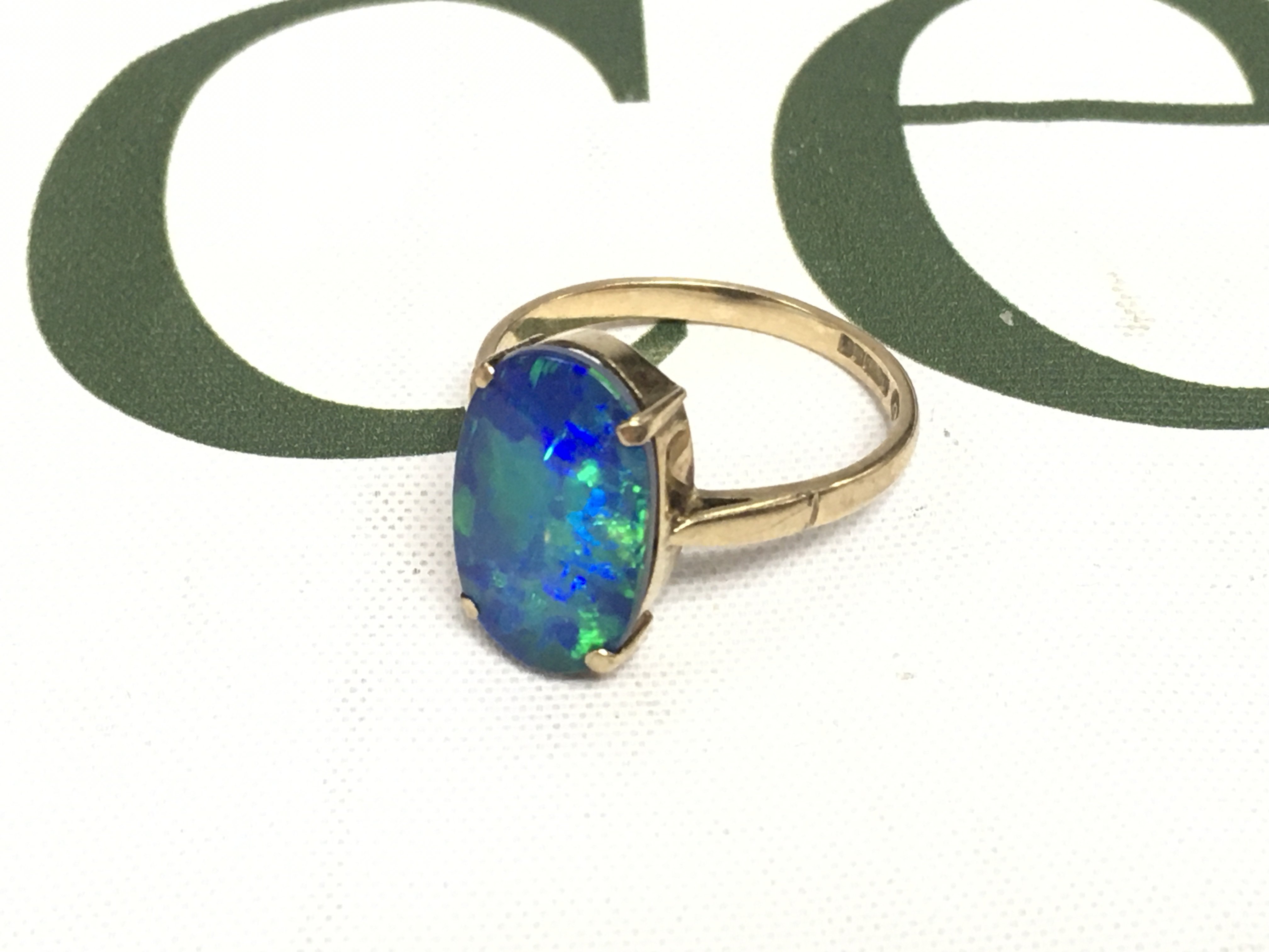 A 9ct gold opal set ring. Approx weight 3.58 grams, size V.